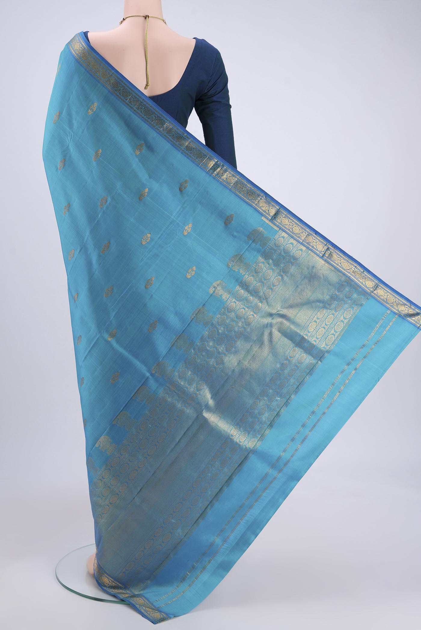 Flat view of Blue Kanjivaram Silk Saree with Zari Butta on the body and Zari Border. 