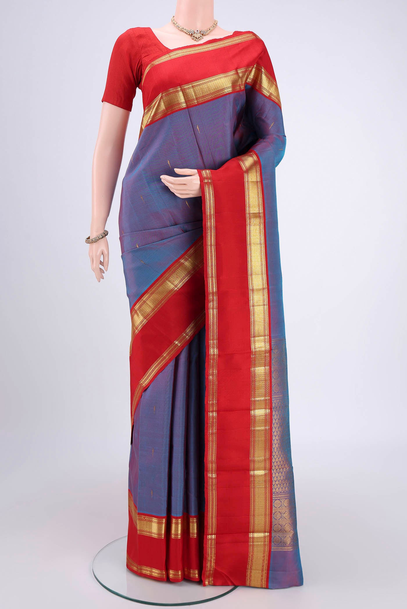 Mauve Dual Tone Kanjivaram Silk Saree with Checked design on the body and Zari Border.  displayed on a mannequin
