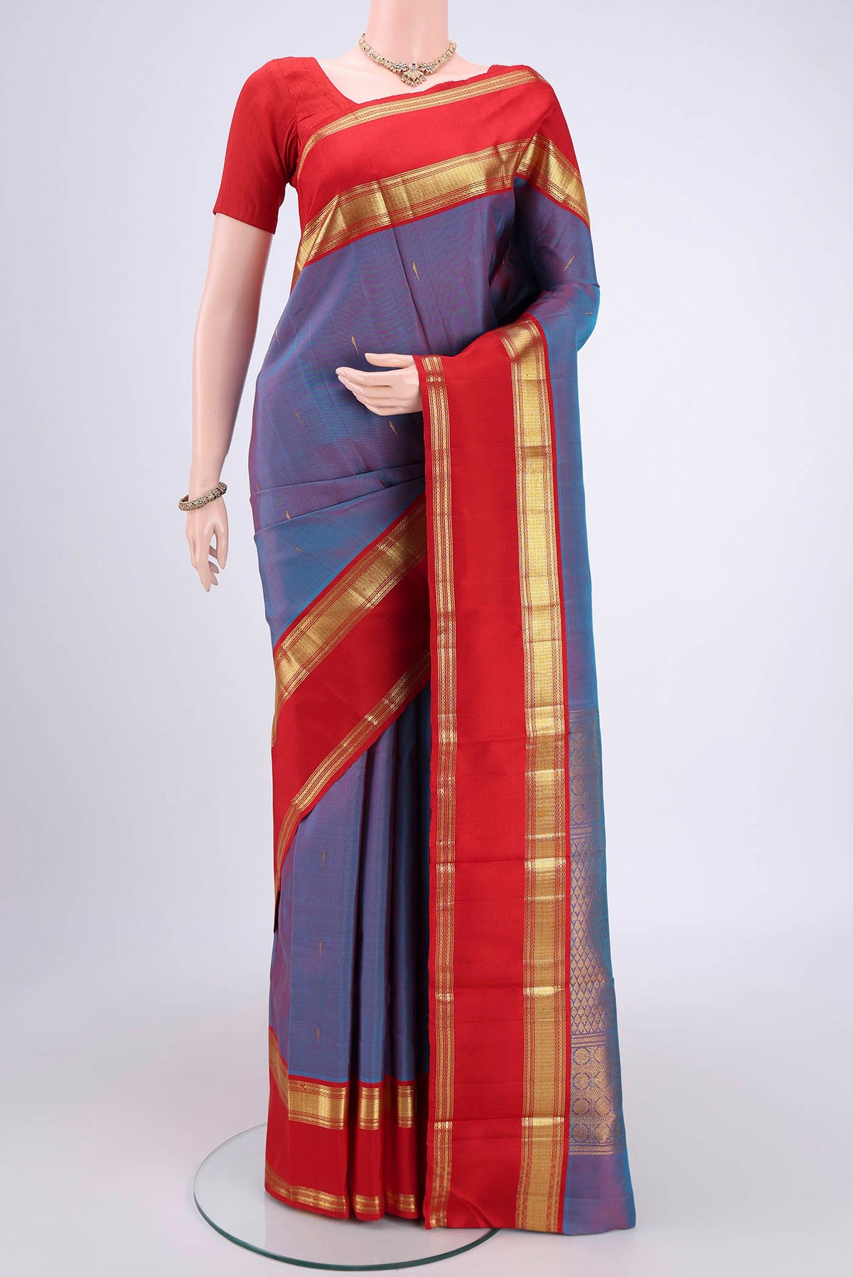 Mauve Dual Tone Kanjivaram Silk Saree with Checked design on the body and Zari Border.  displayed on a mannequin