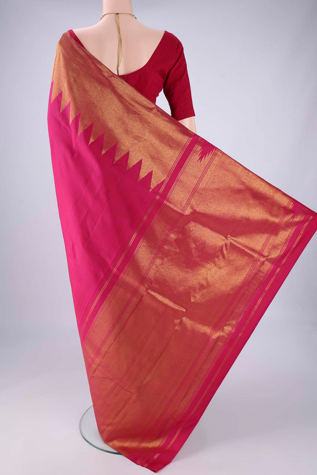 Flat view of Pink Kanjivaram Silk Saree with Plain Body and Temple Border. 