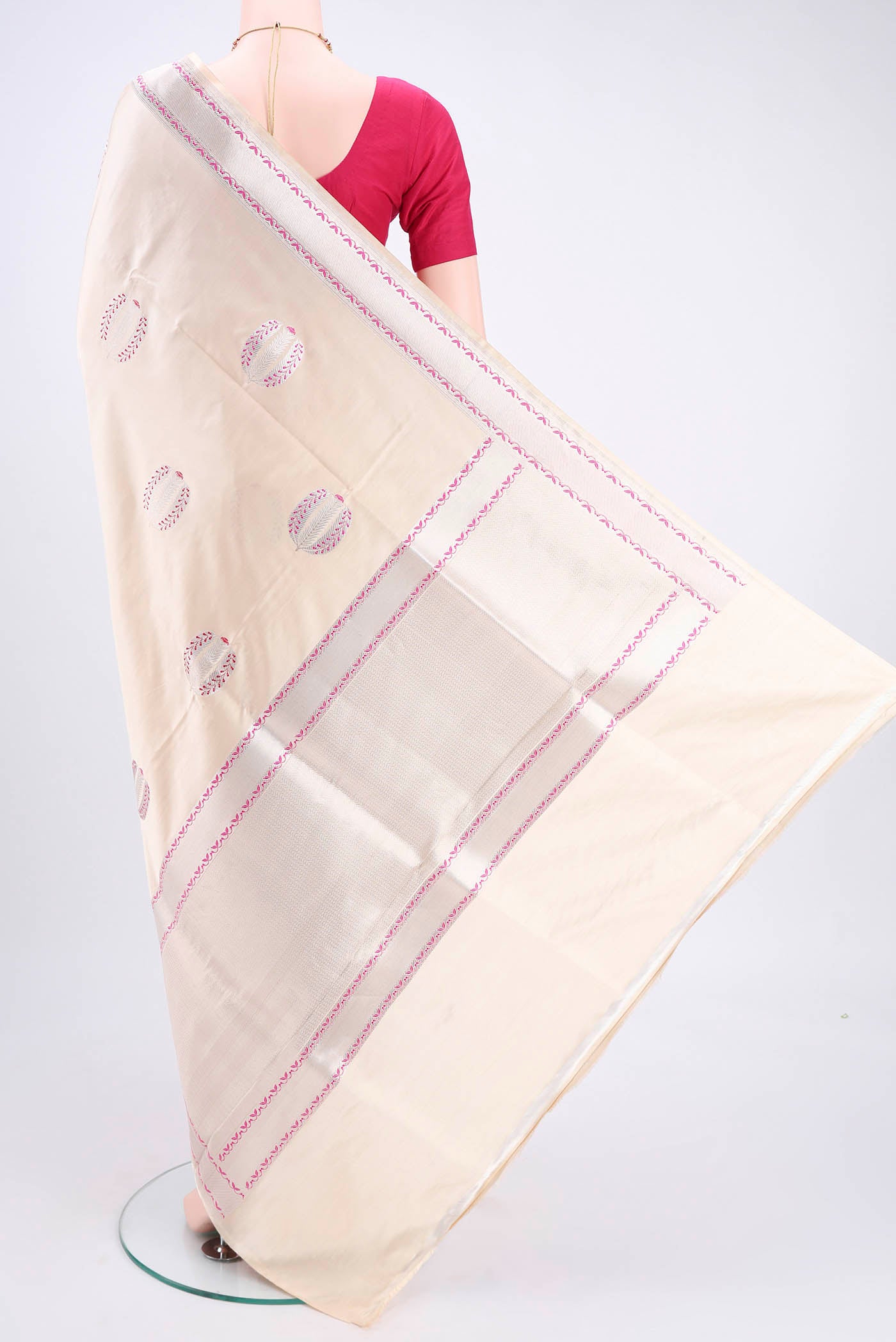 Flat view of Cream Banarasi Silk Saree with Zari And Thread Butta on the body and Zari And Thread Border. 