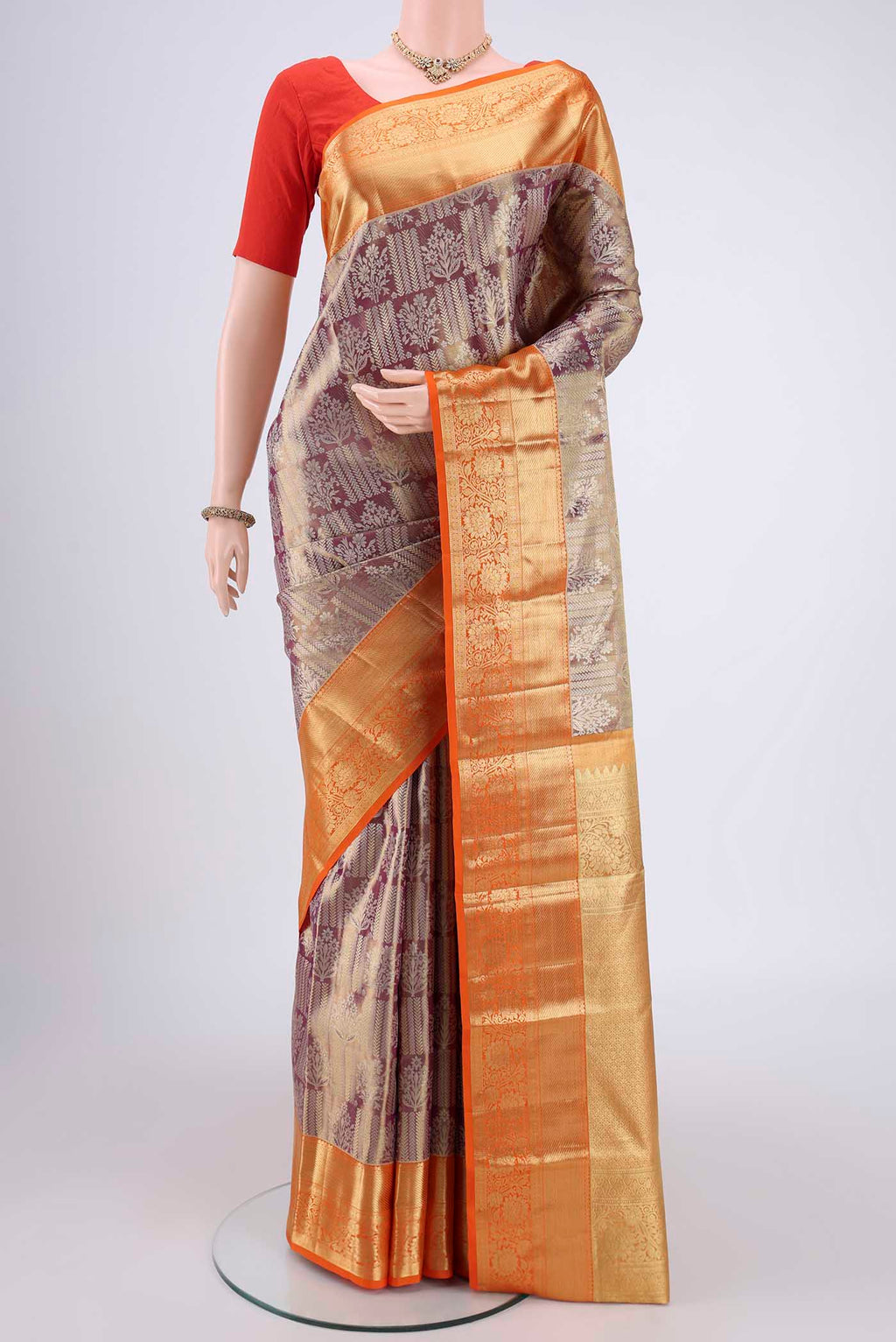 Magenta Dual Tone Kanchipuram Tissue Silk Saree with Zari Brocade on the body and Zari Border.  displayed on a mannequin