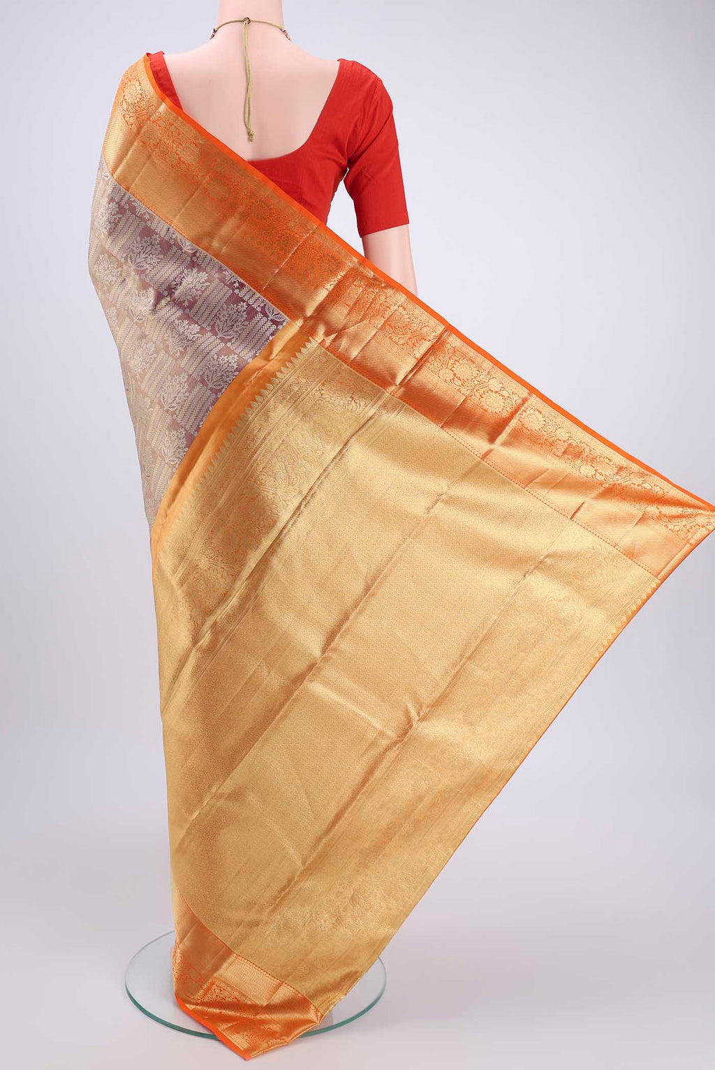 Flat view of Magenta Dual Tone Kanchipuram Tissue Silk Saree with Zari Brocade on the body and Zari Border. 