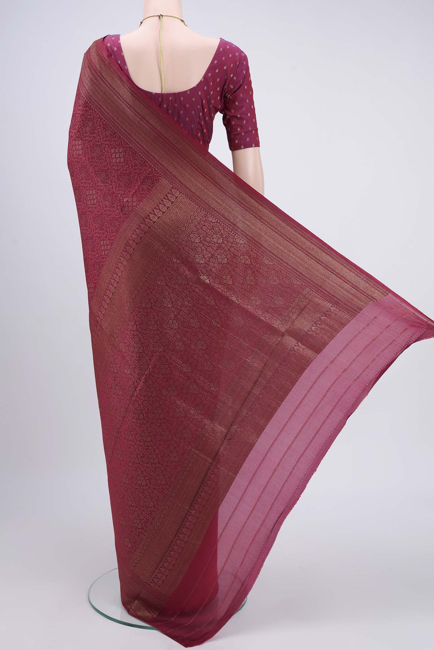 Flat view of Maroon Mysore Crepe Saree with Zari Brocade on the body and Zari Border. 