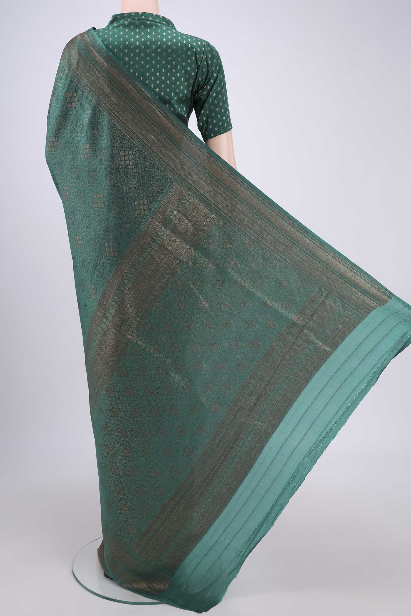 Flat view of Green Mysore Crepe Saree with Zari Brocade on the body and Zari Border. 