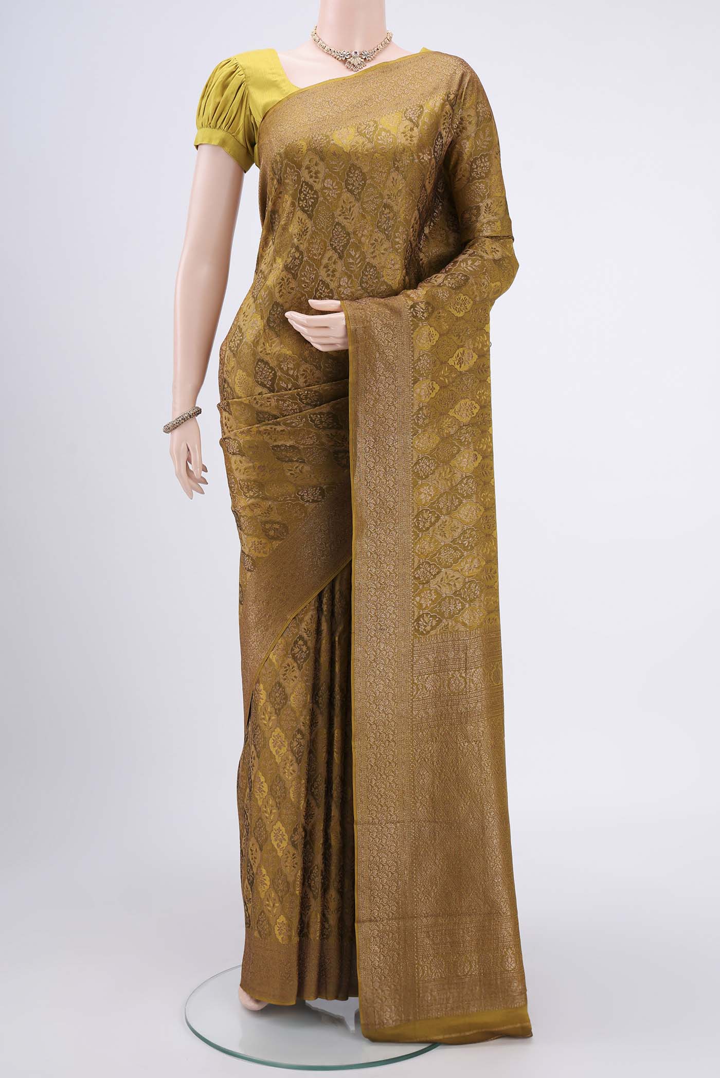 Mehandi Green Mysore Crepe Saree with Zari Brocade on the body and Zari Border.  displayed on a mannequin