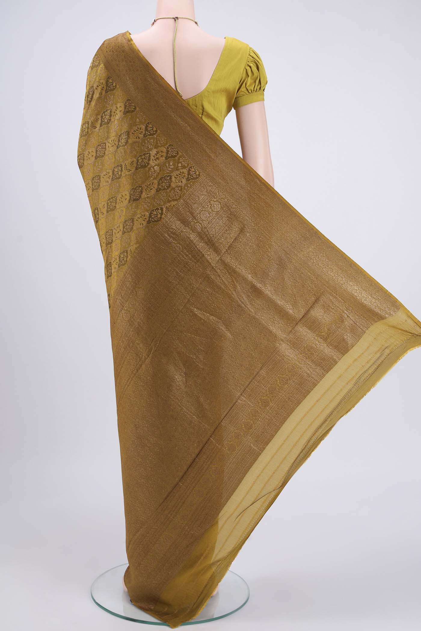 Flat view of Mehandi Green Mysore Crepe Saree with Zari Brocade on the body and Zari Border. 
