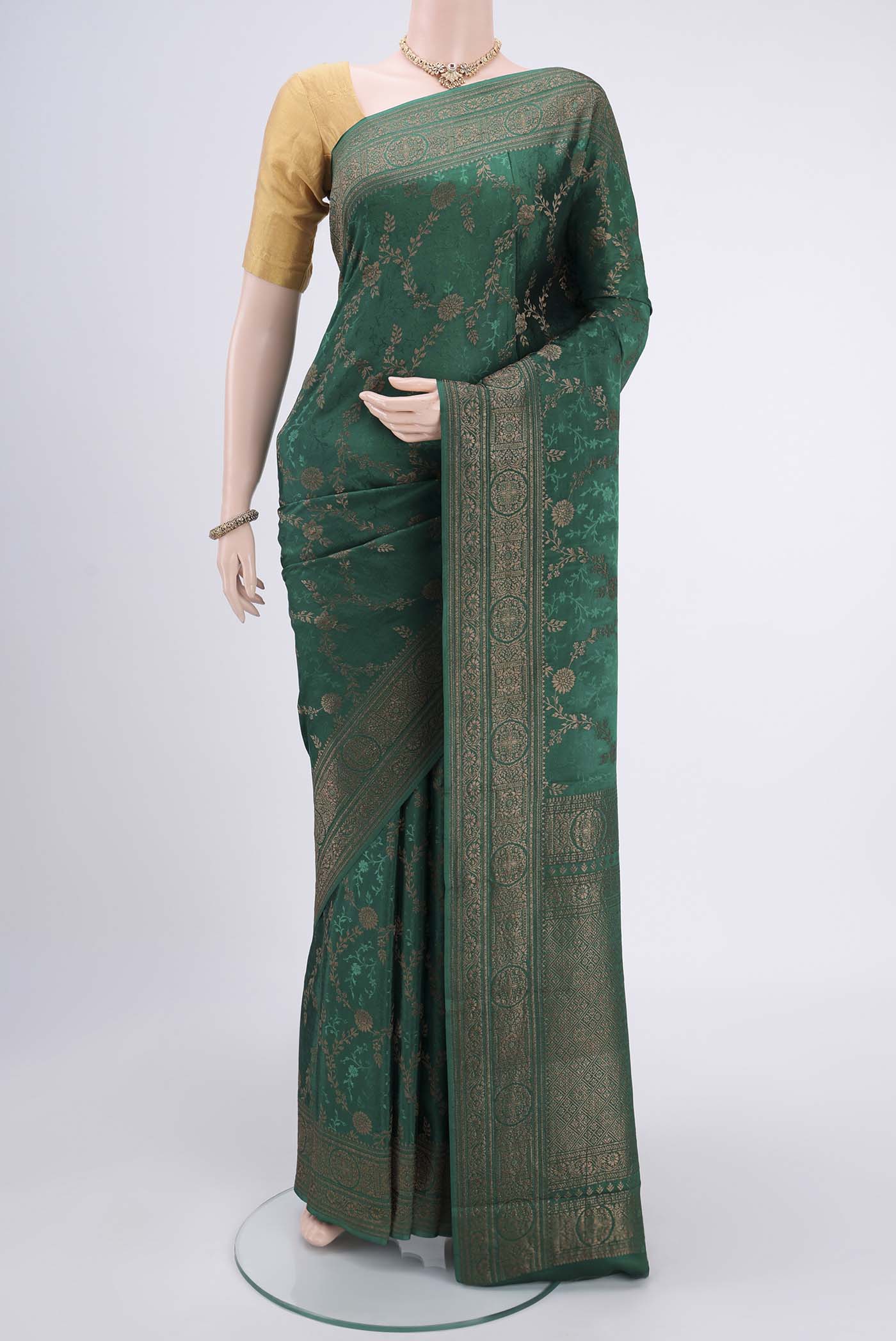 Sea Green Mysore Crepe Saree with Zari Brocade on the body and Zari Border.  displayed on a mannequin