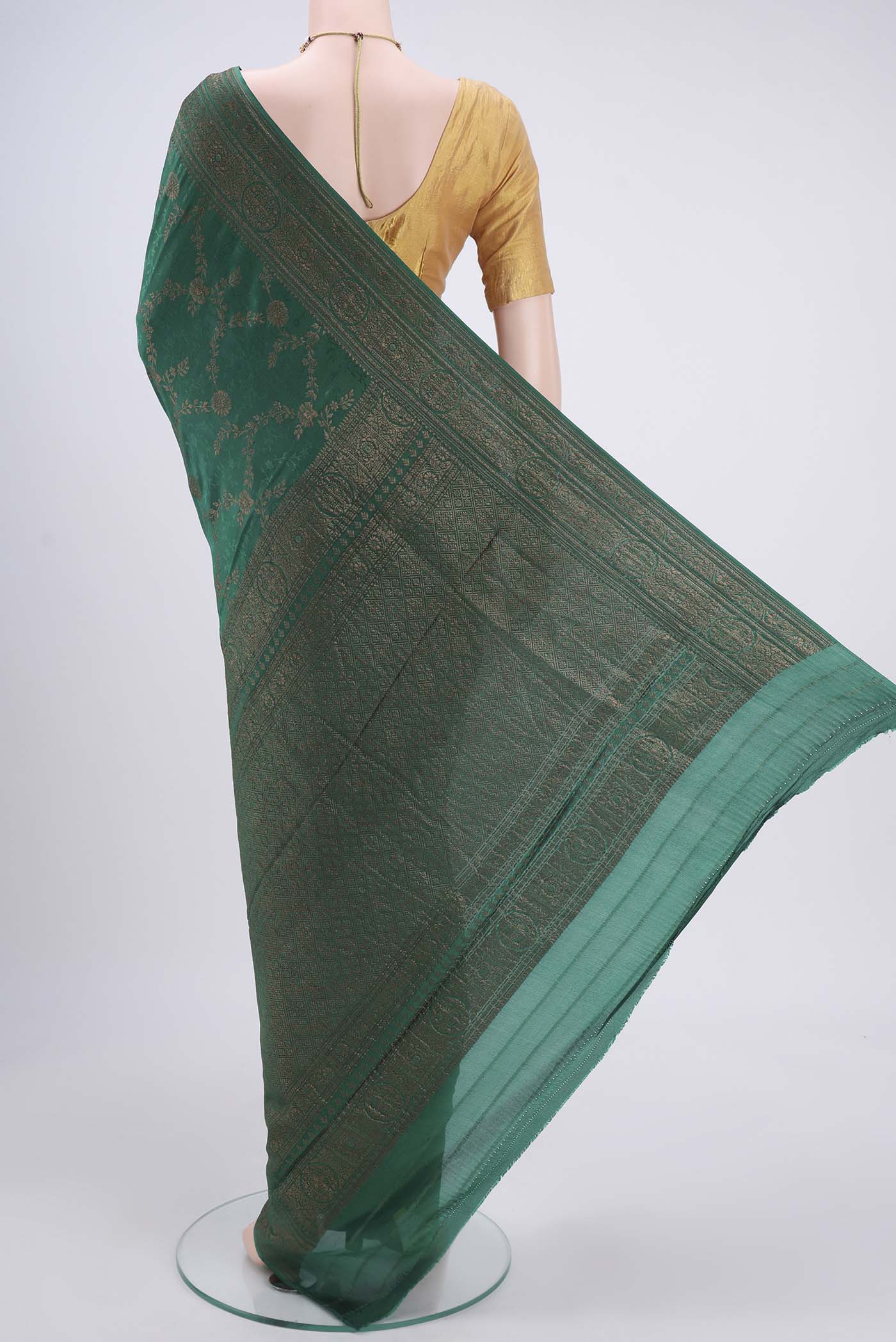 Flat view of Sea Green Mysore Crepe Saree with Zari Brocade on the body and Zari Border. 