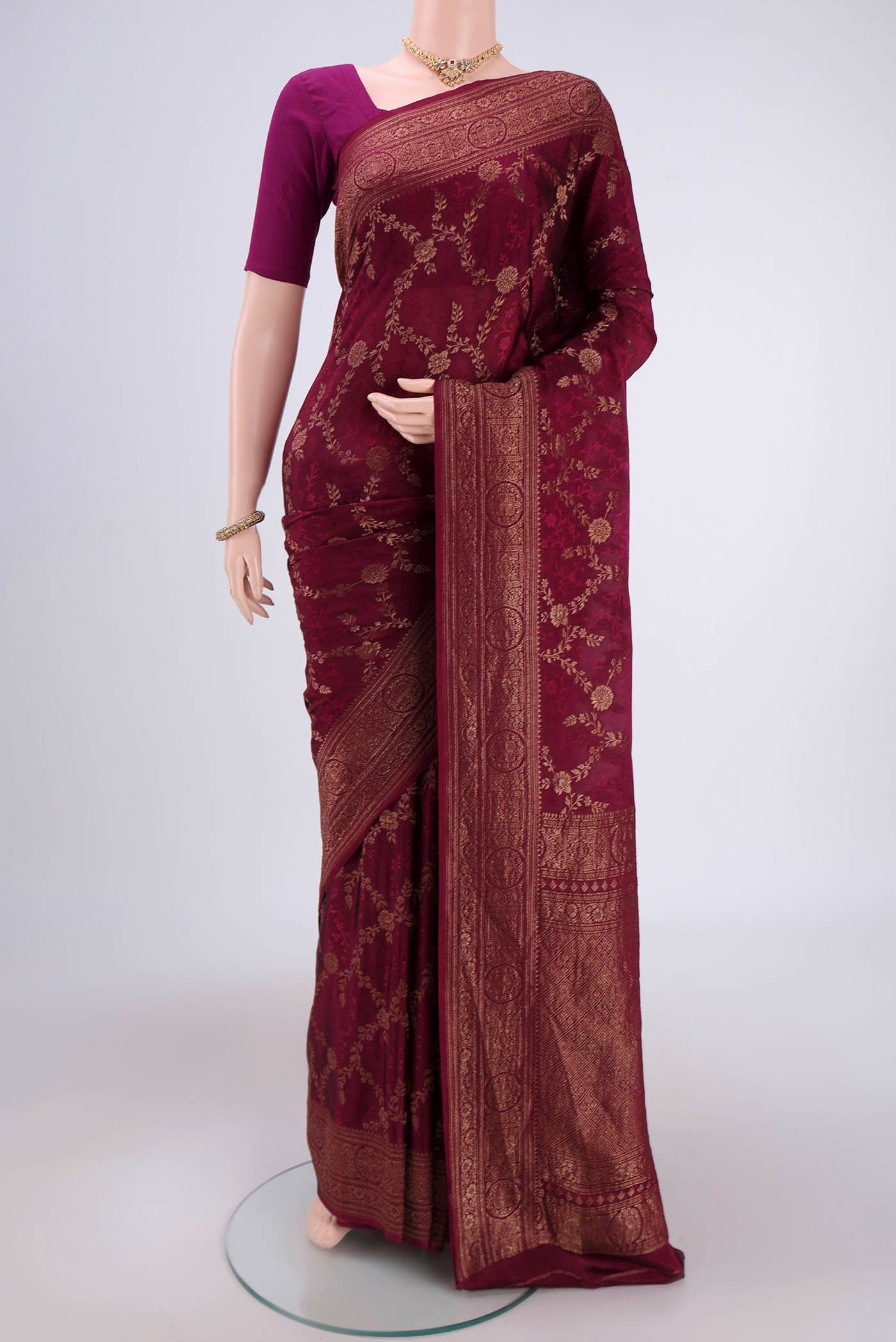 Magenta Mysore Crepe Saree with Zari Brocade on the body and Zari Border.  displayed on a mannequin
