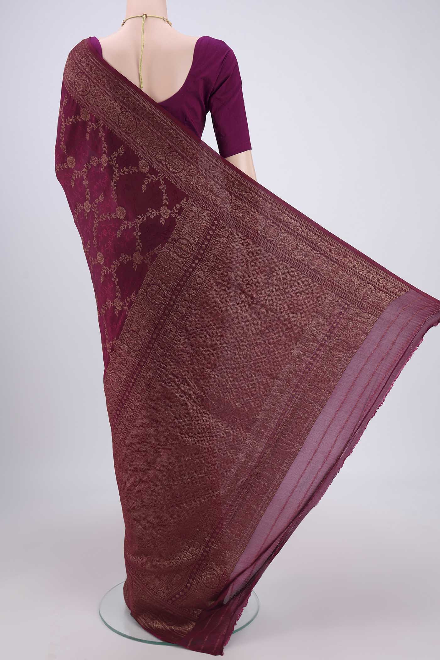 Flat view of Magenta Mysore Crepe Saree with Zari Brocade on the body and Zari Border. 