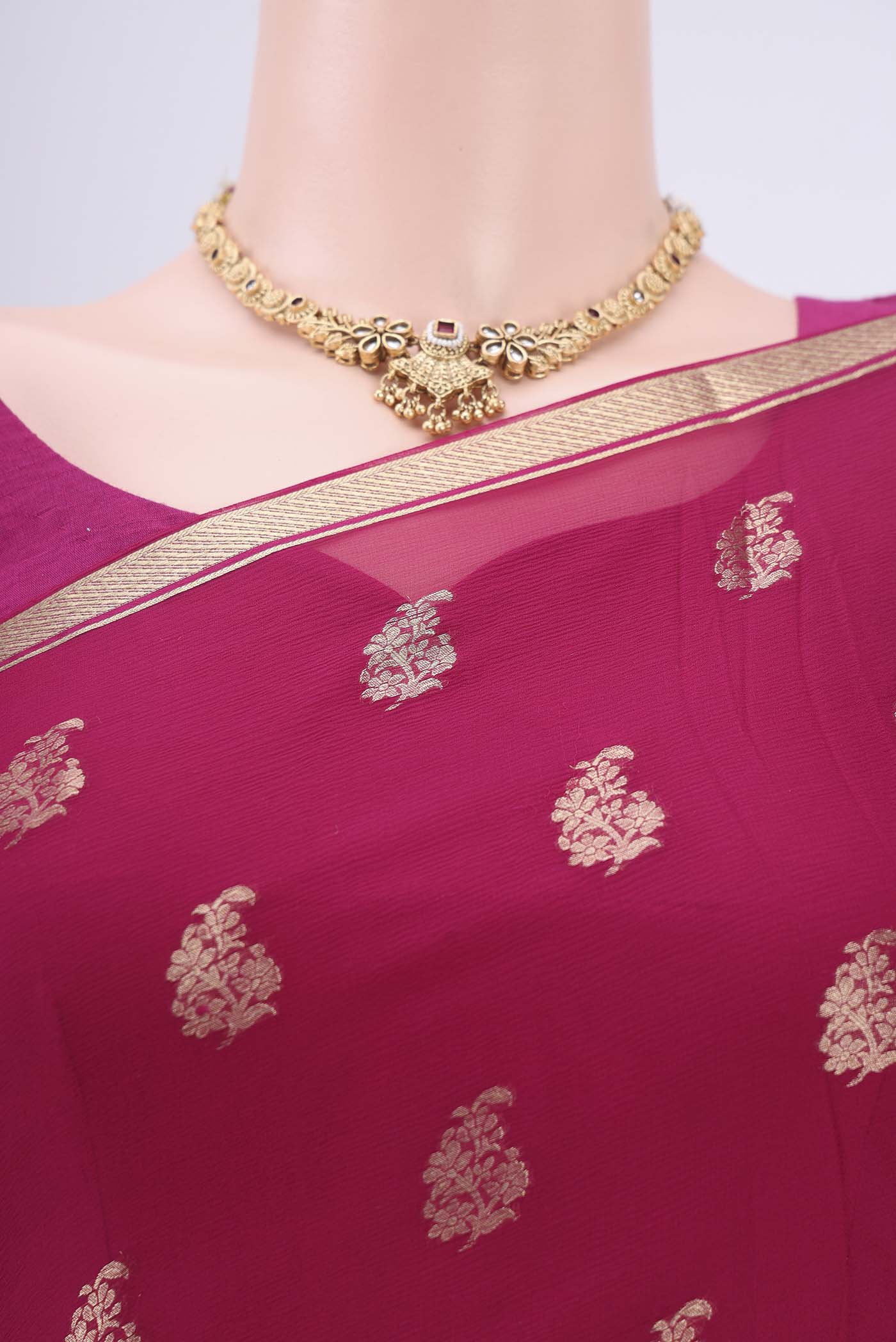 Border image of Rani Pink Mysore Chiffon Saree with Zari Butta on the body and Zari Border. 
