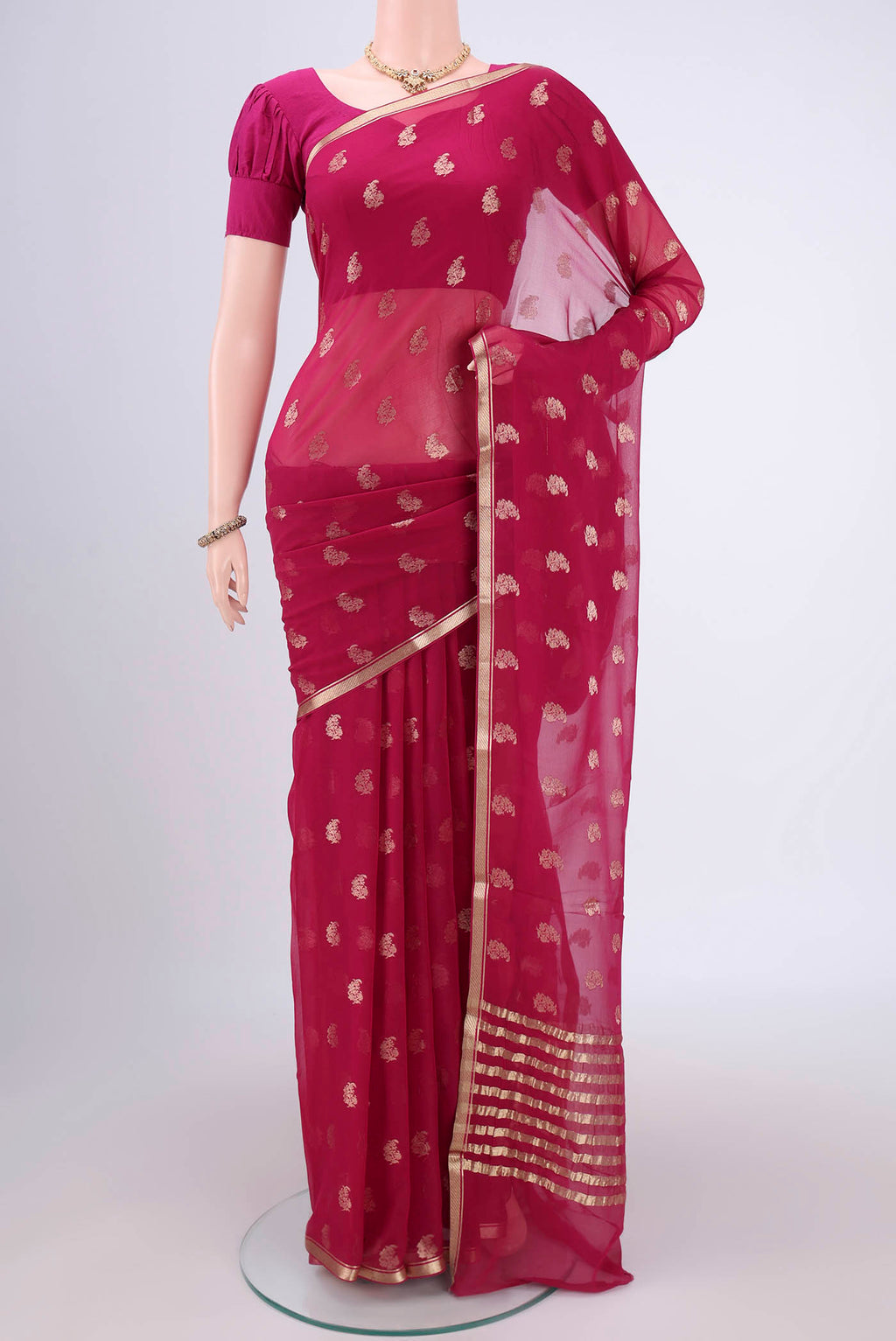 Rani Pink Mysore Chiffon Saree with Zari Butta on the body and Zari Border.  displayed on a mannequin
