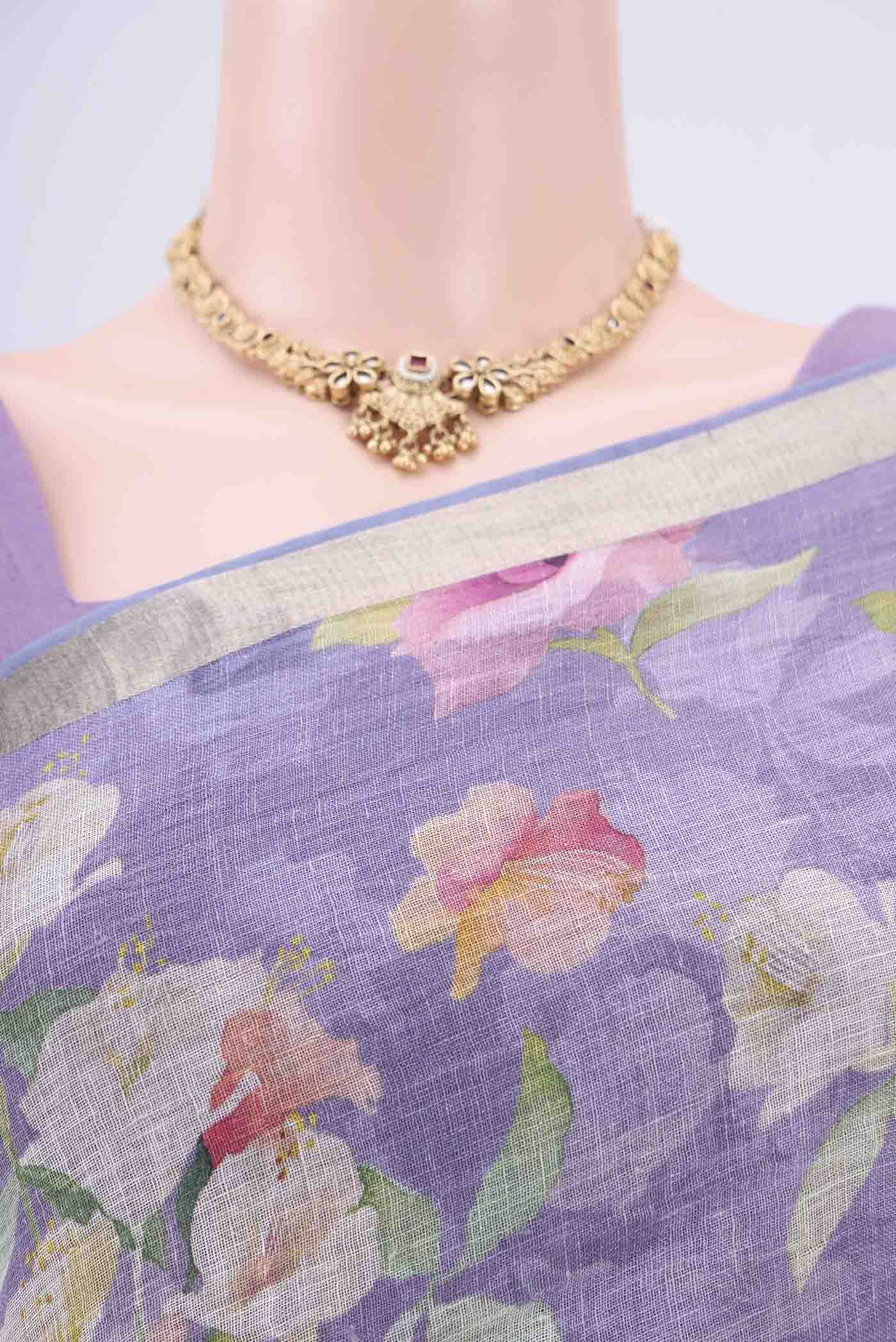 Border image of Purple Linen Saree with Floral Print on the body and Zari Border. 