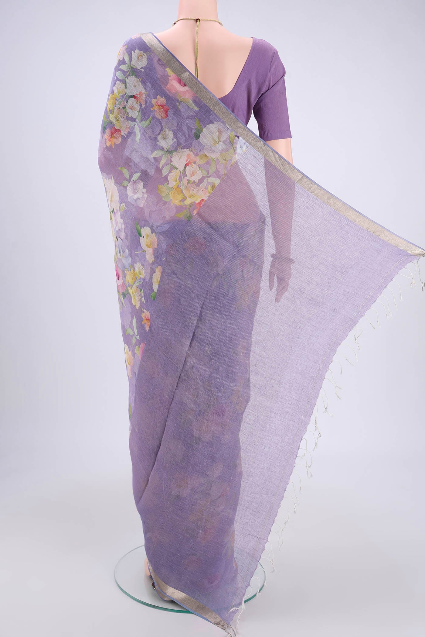 Flat view of Purple Linen Saree with Floral Print on the body and Zari Border. 