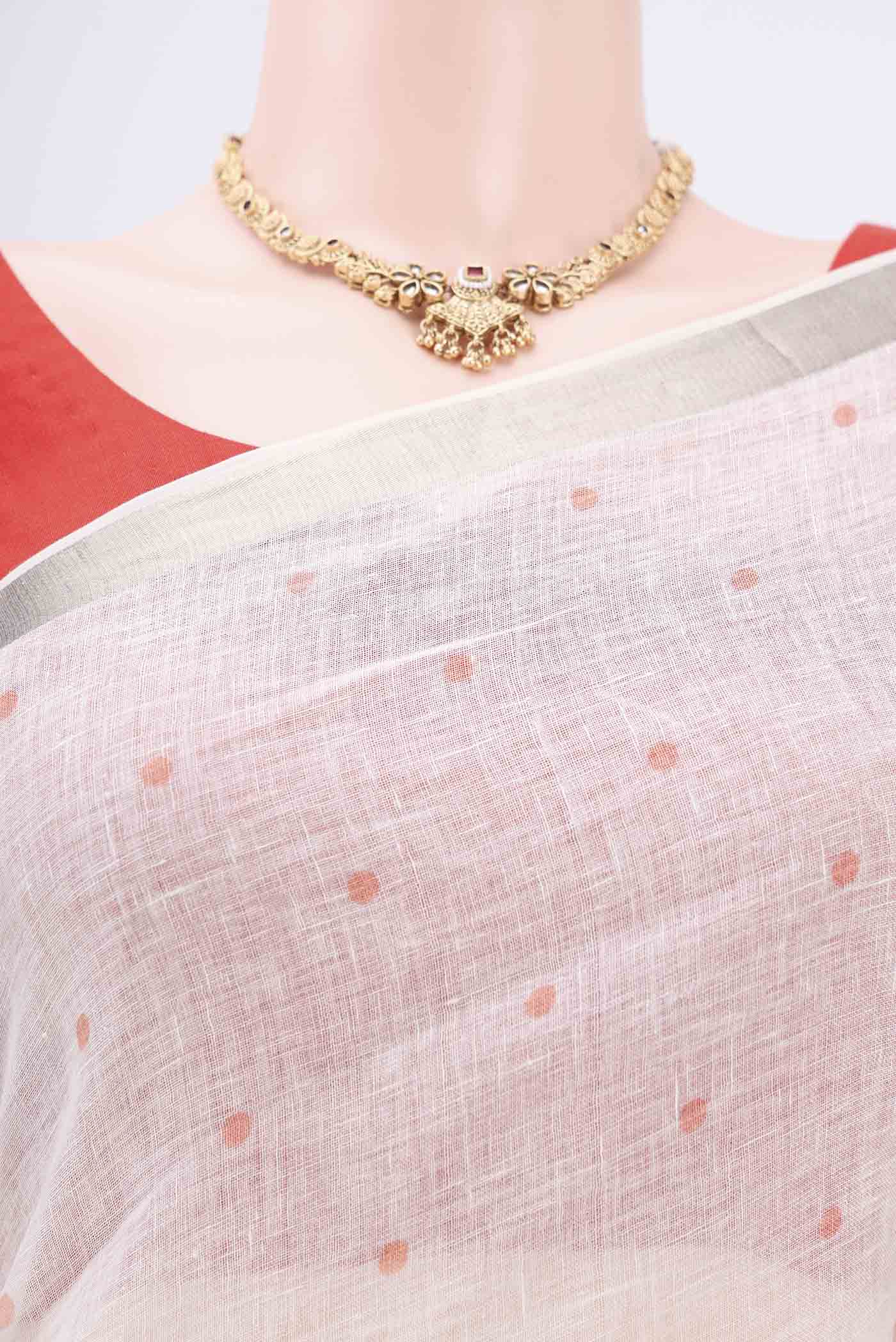 Border image of White Linen Saree with Floral Print on the body and Zari Border. 