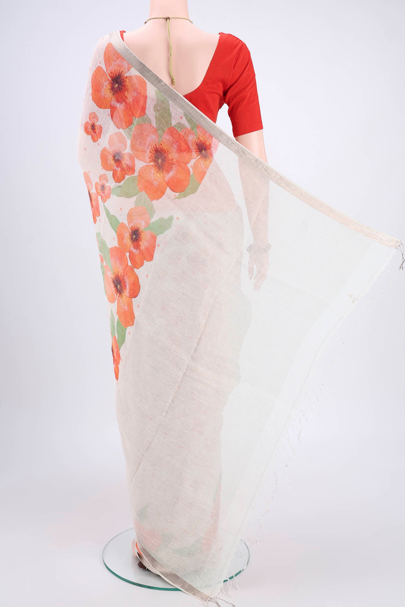 Flat view of White Linen Saree with Floral Print on the body and Zari Border. 