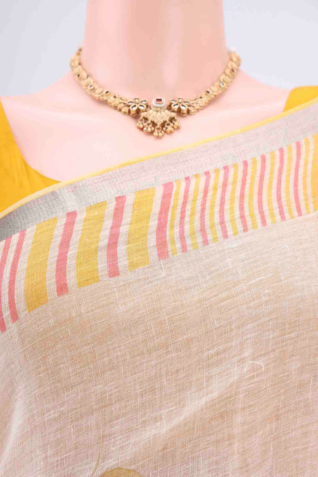 Border image of Beige Linen Saree with Floral Print on the body and Zari Border. 