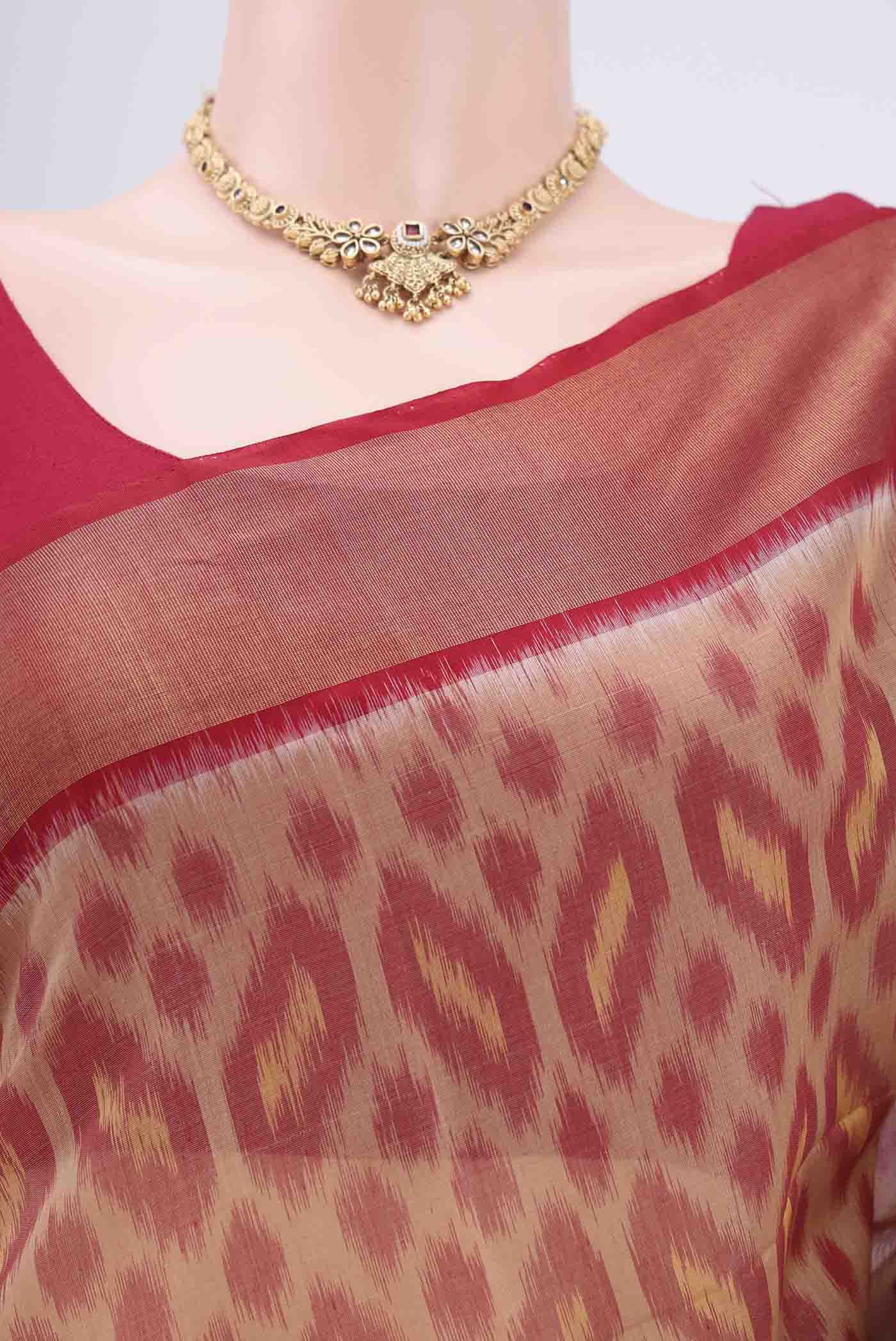 Border image of Dark Beige Silk Cotton Saree with Ikat design on the body and Zari Border. 