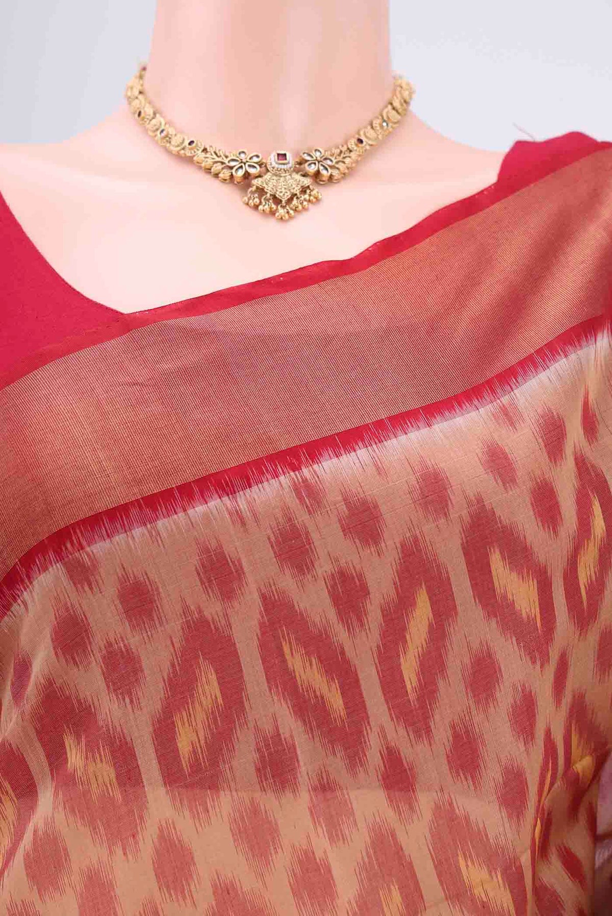 Border image of Dark Beige Silk Cotton Saree with Ikat design on the body and Zari Border. 