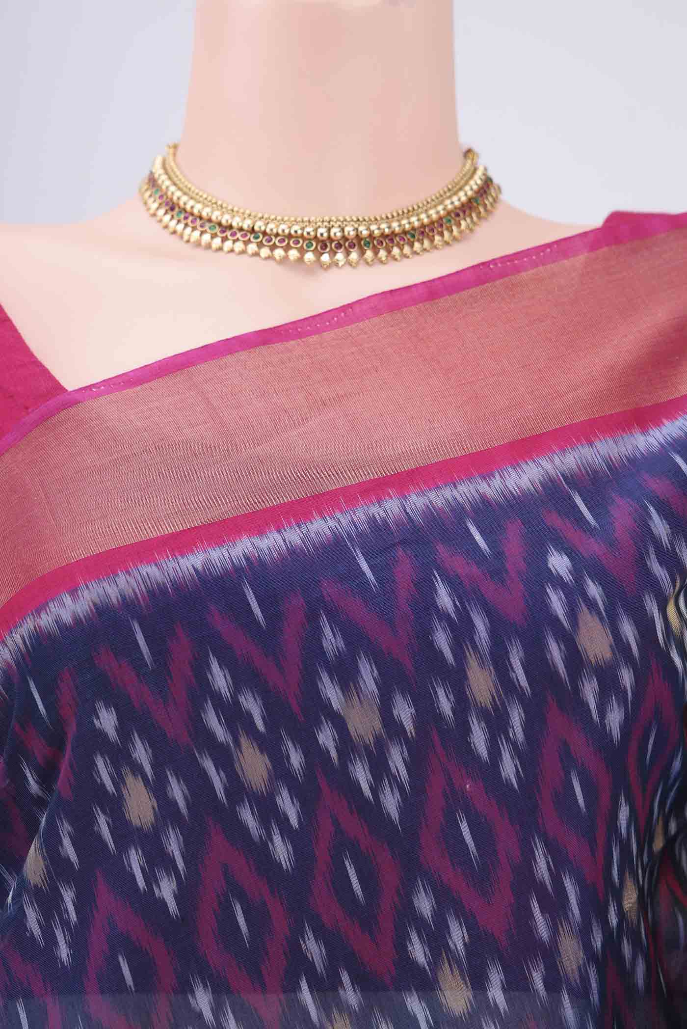 Border image of Navy Blue Silk Cotton Saree with Ikat design on the body and Zari Border. 