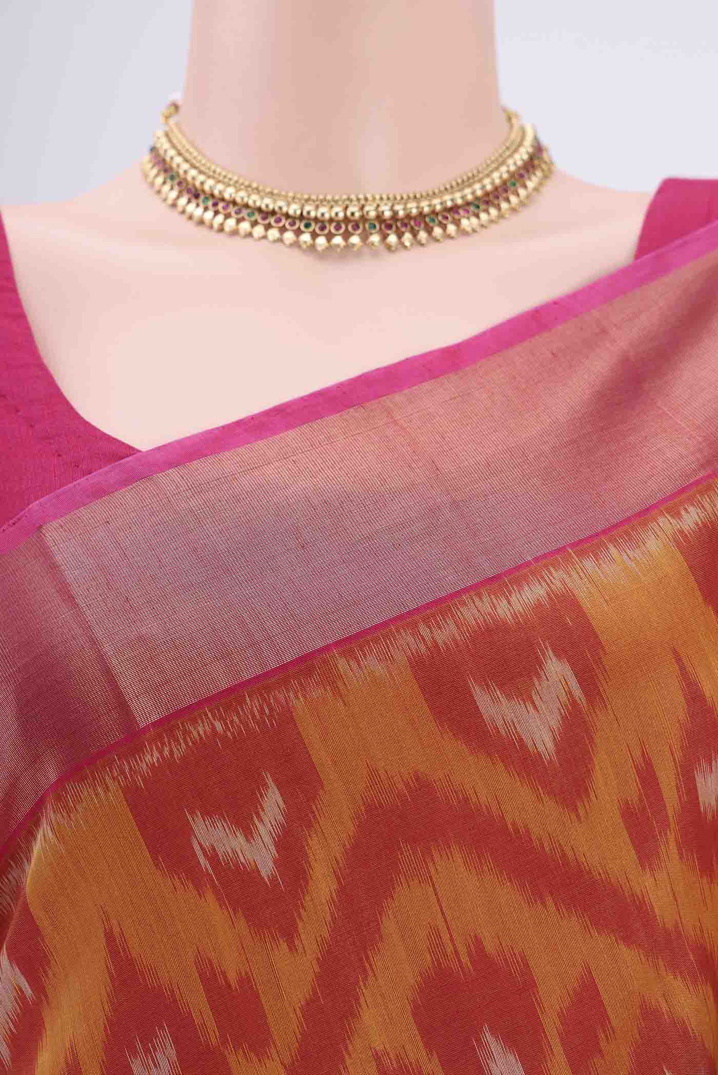 Border image of Mustard Silk Cotton Saree with Ikat design on the body and Zari Border. 