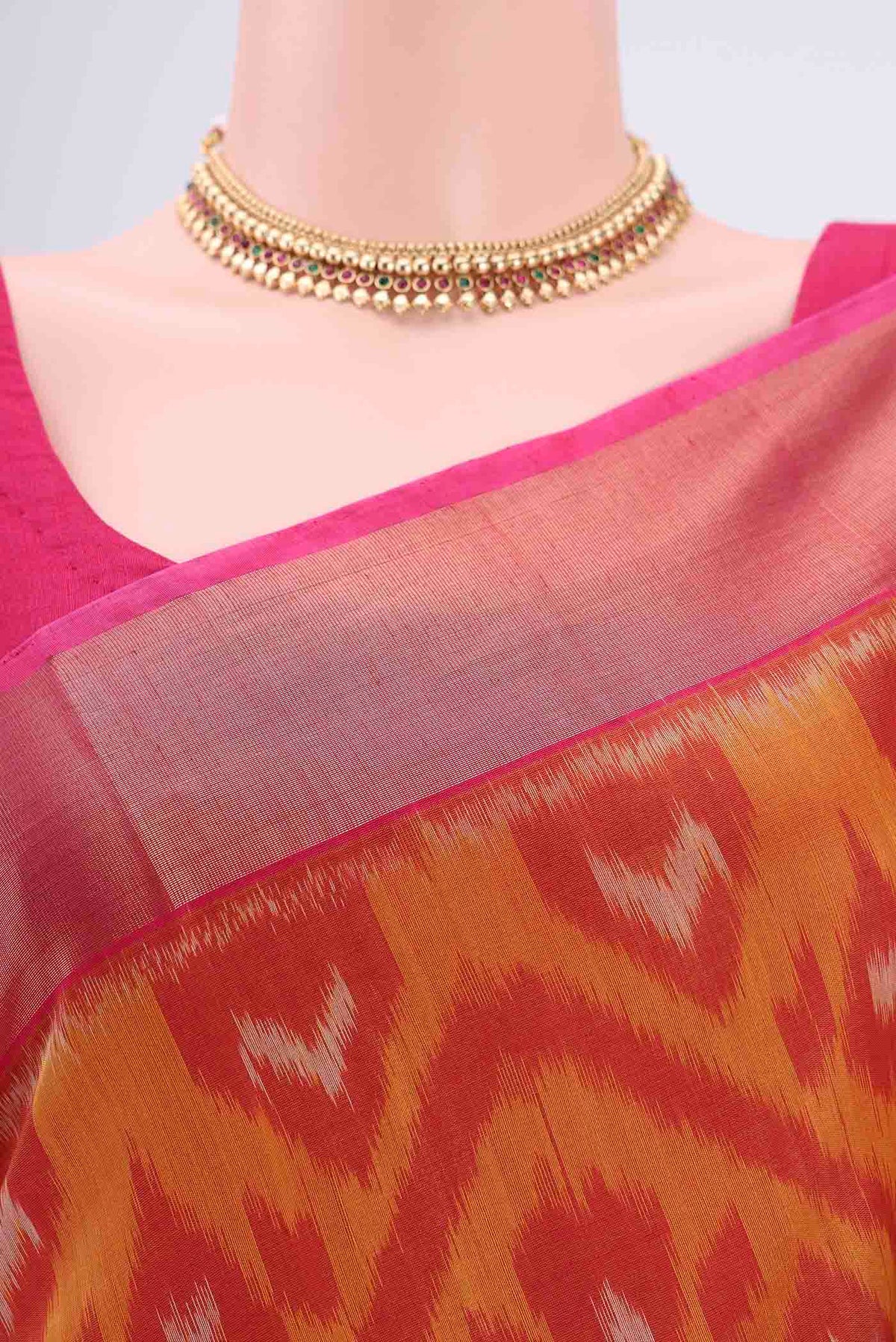 Border image of Mustard Silk Cotton Saree with Ikat design on the body and Zari Border. 