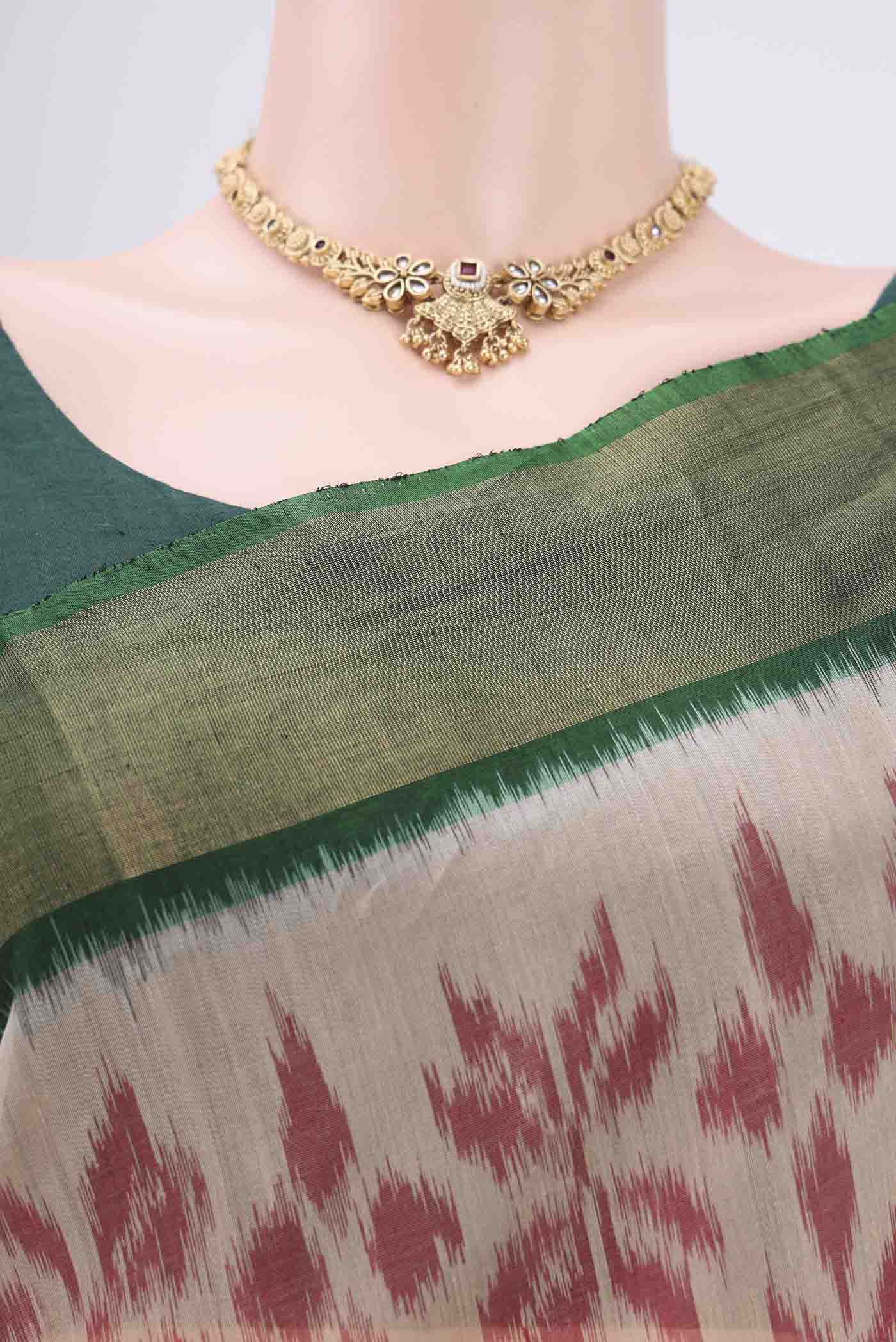 Border image of Beige Silk Cotton Saree with Ikat design on the body and Zari Border. 
