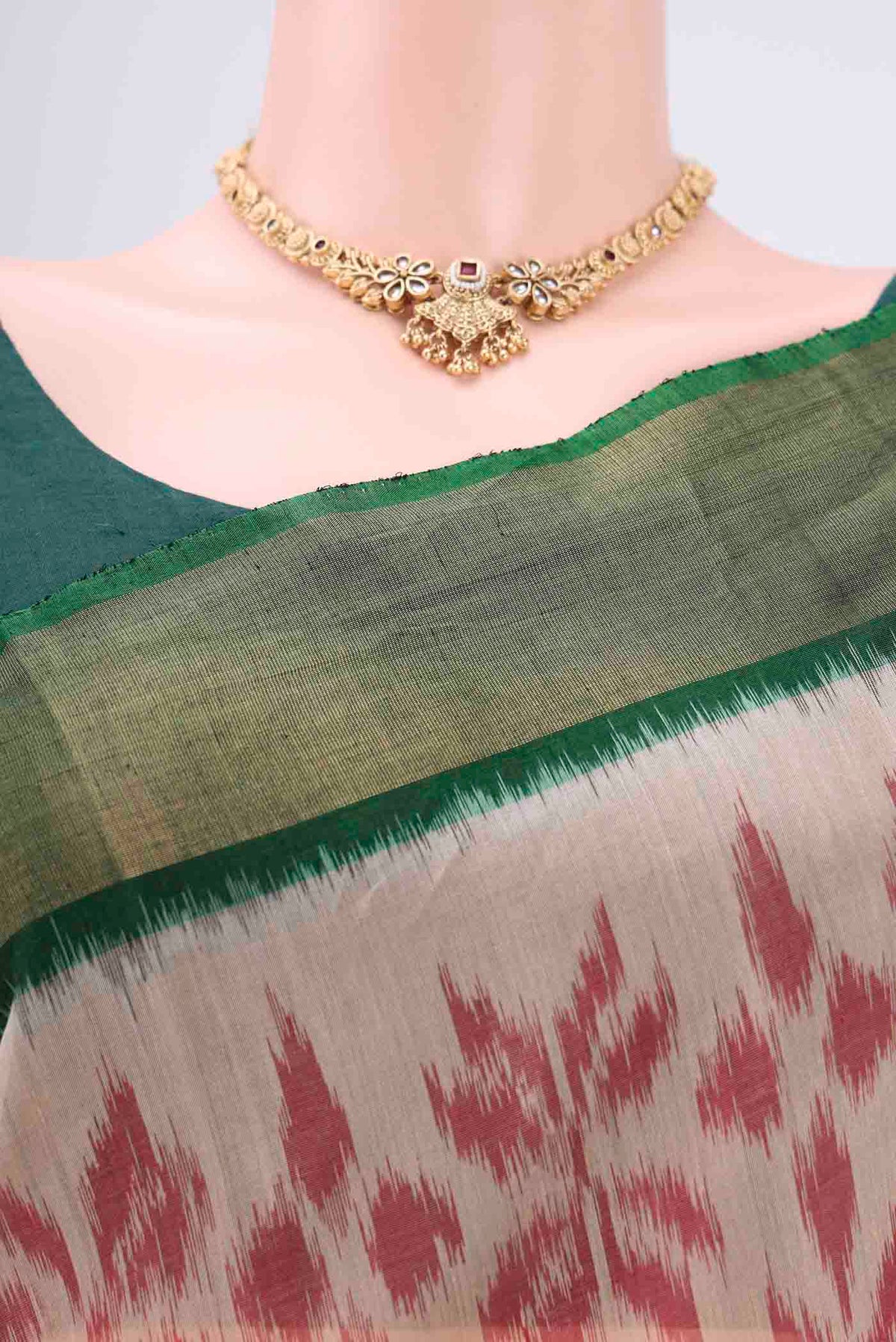 Border image of Beige Silk Cotton Saree with Ikat design on the body and Zari Border. 