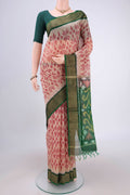 Beige Silk Cotton Saree with Ikat design on the body and Zari Border.  displayed on a mannequin