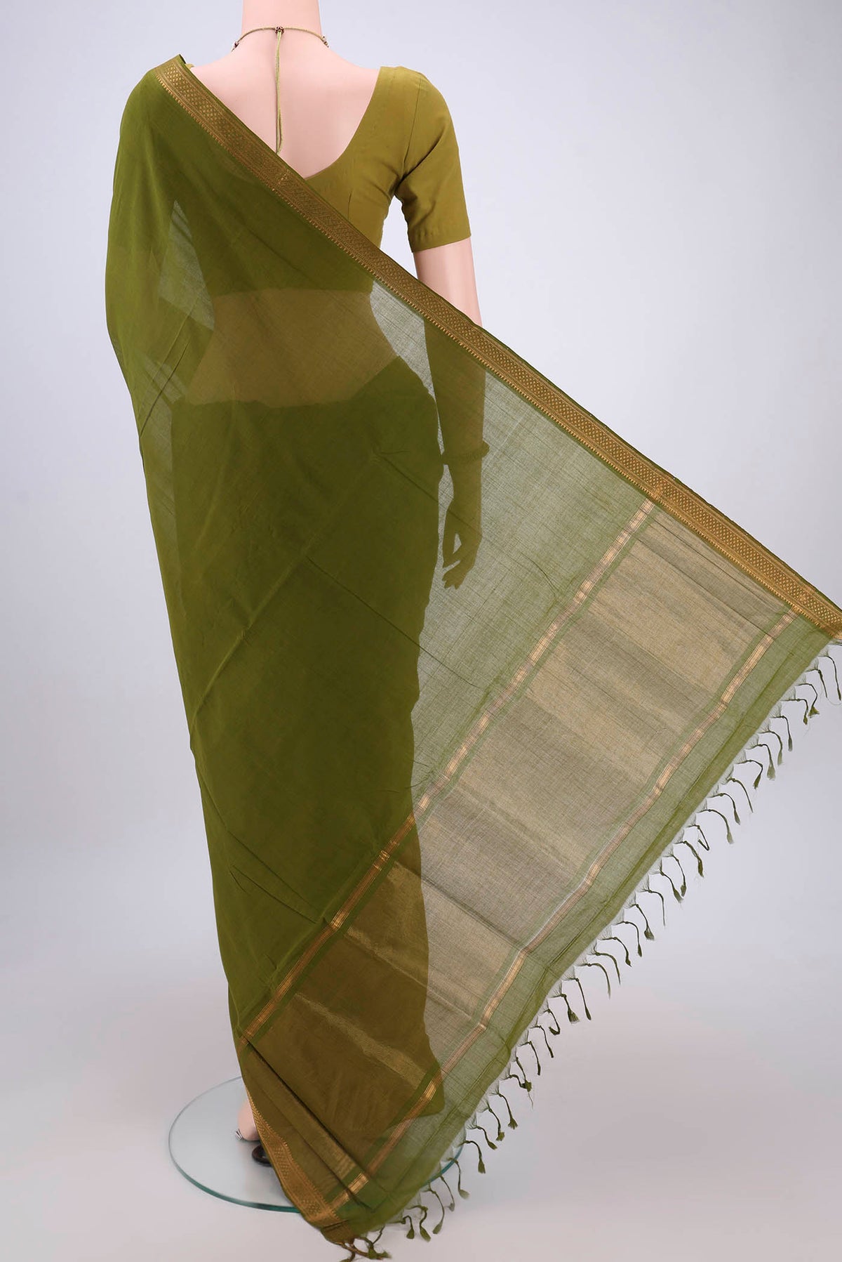 Flat view of Green Mangalagiri Cotton Saree with Plain Body and Zari Border. 