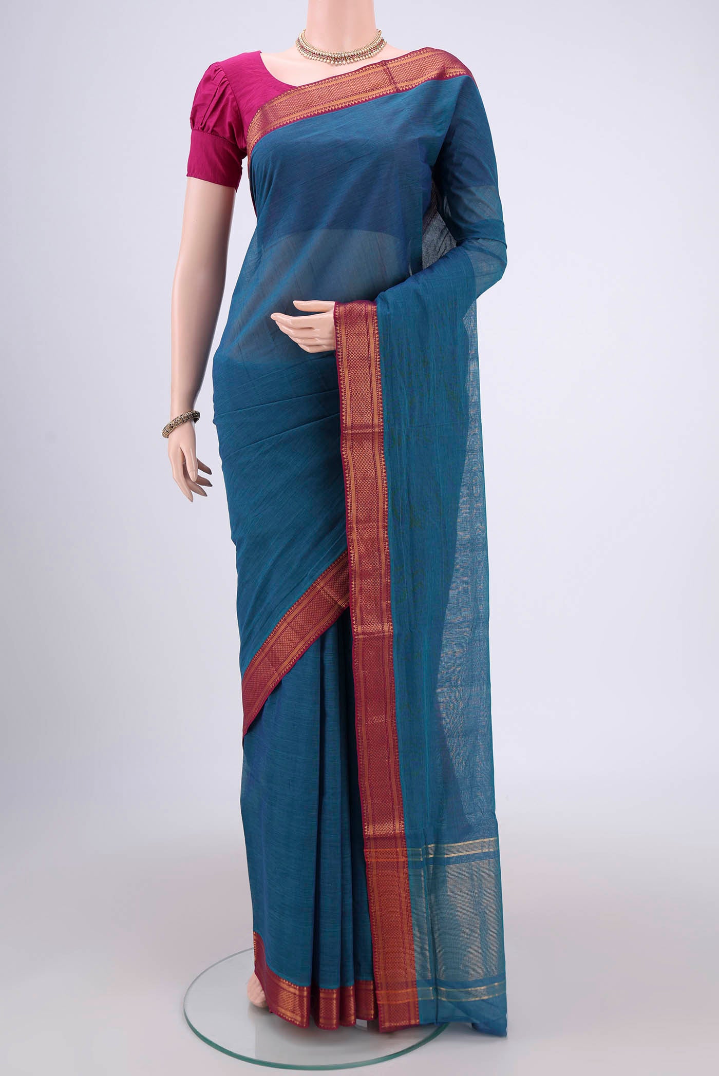 Peacock Blue Mangalagiri Cotton Saree with Plain Body and Zari Border.  displayed on a mannequin