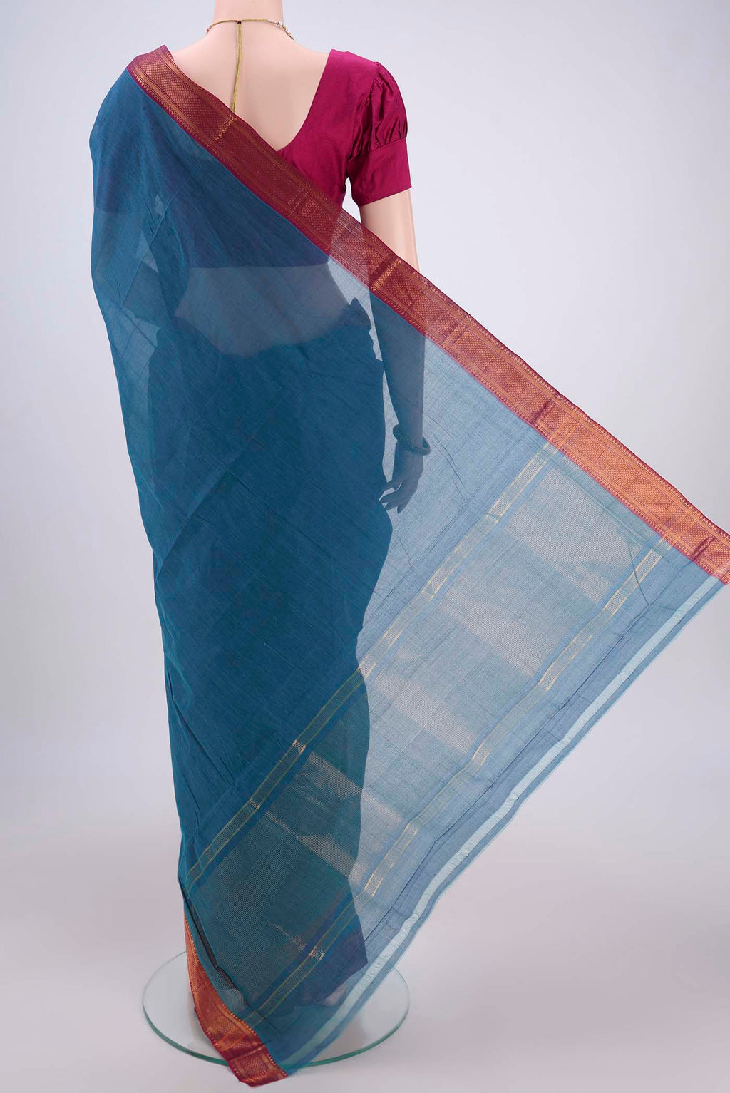 Flat view of Peacock Blue Mangalagiri Cotton Saree with Plain Body and Zari Border. 