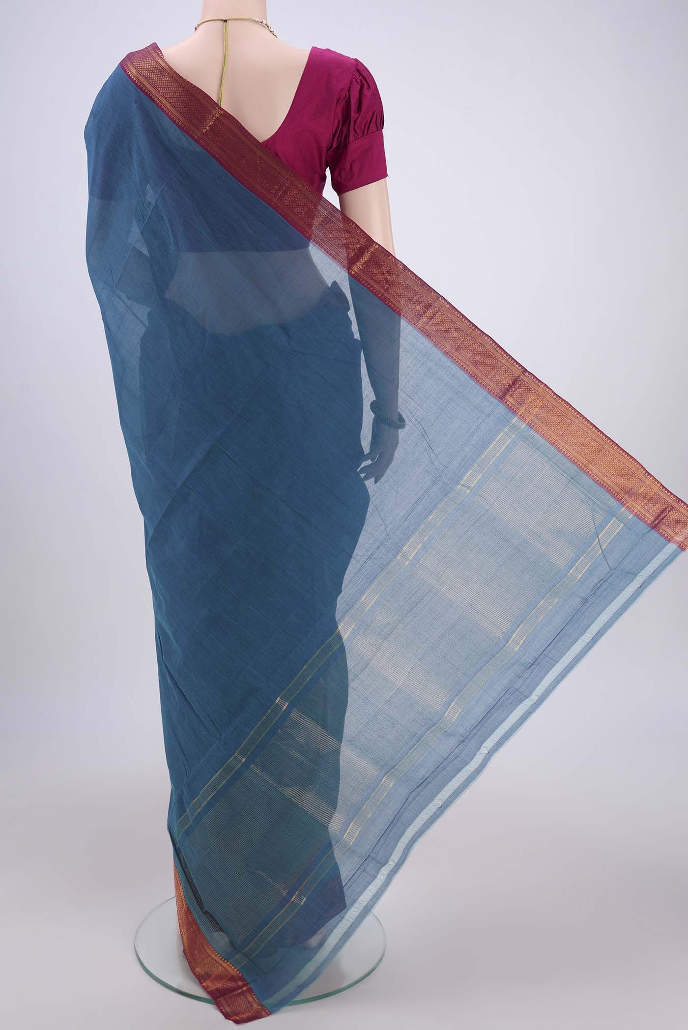 Flat view of Peacock Blue Mangalagiri Cotton Saree with Plain Body and Zari Border. 