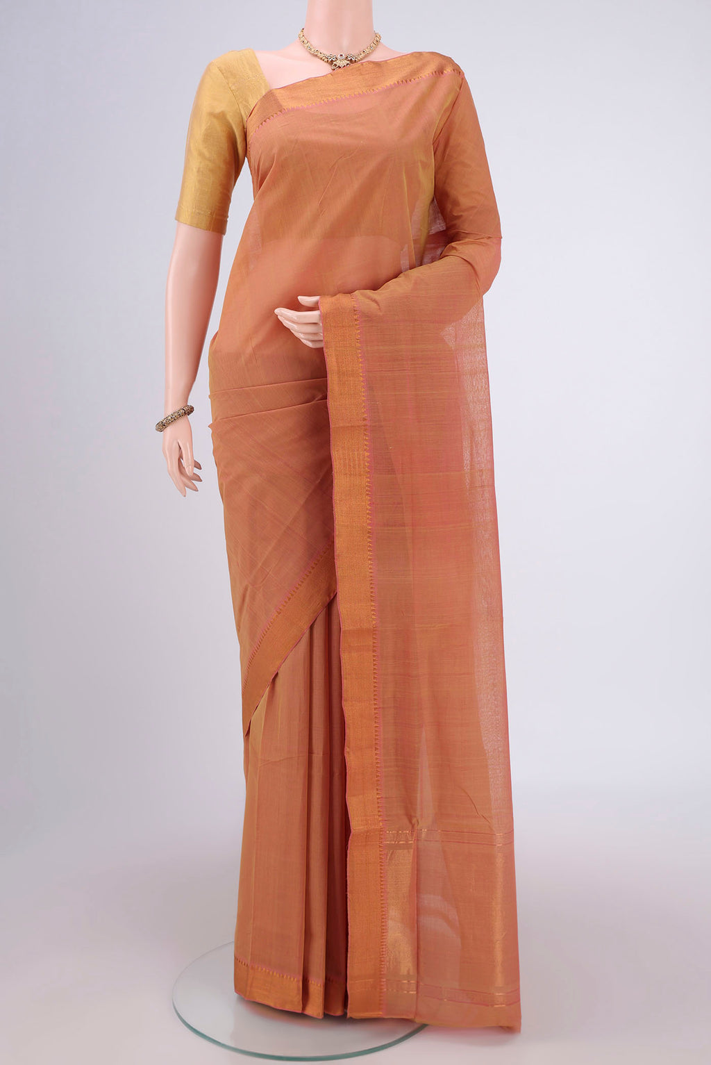 Mustard Mangalagiri Cotton Saree with Plain Body and Zari Border.  displayed on a mannequin