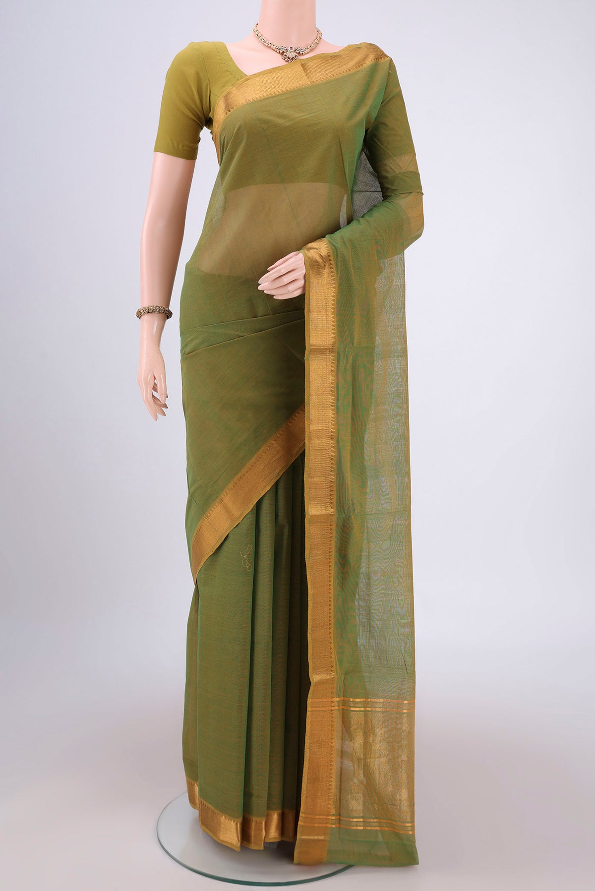 Light Green Mangalagiri Cotton Saree with Plain Body and Zari Border.  displayed on a mannequin
