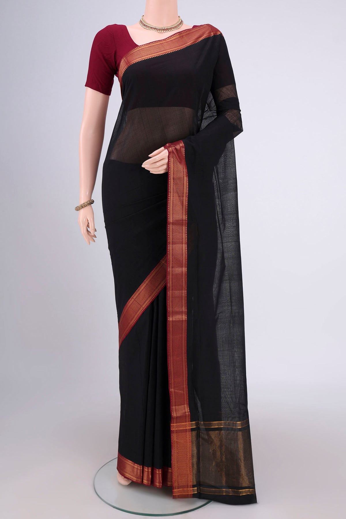 Black Mangalagiri Cotton Saree with Plain Body and Zari Border.  displayed on a mannequin
