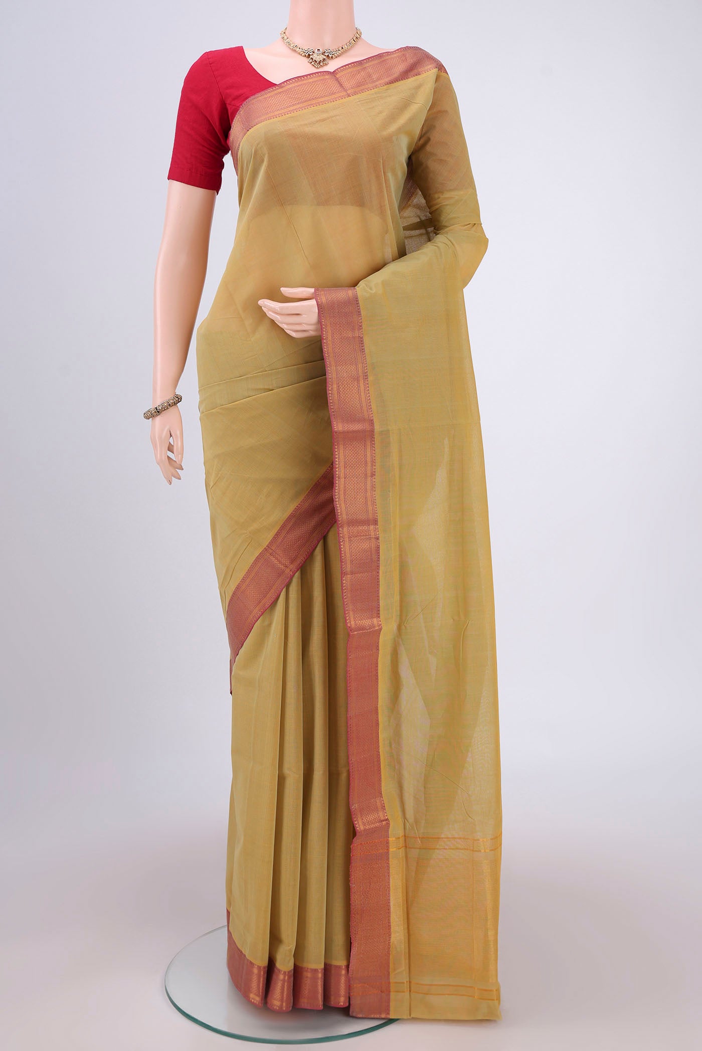 Golden Mangalagiri Cotton Saree with Plain Body and Zari Border.  displayed on a mannequin