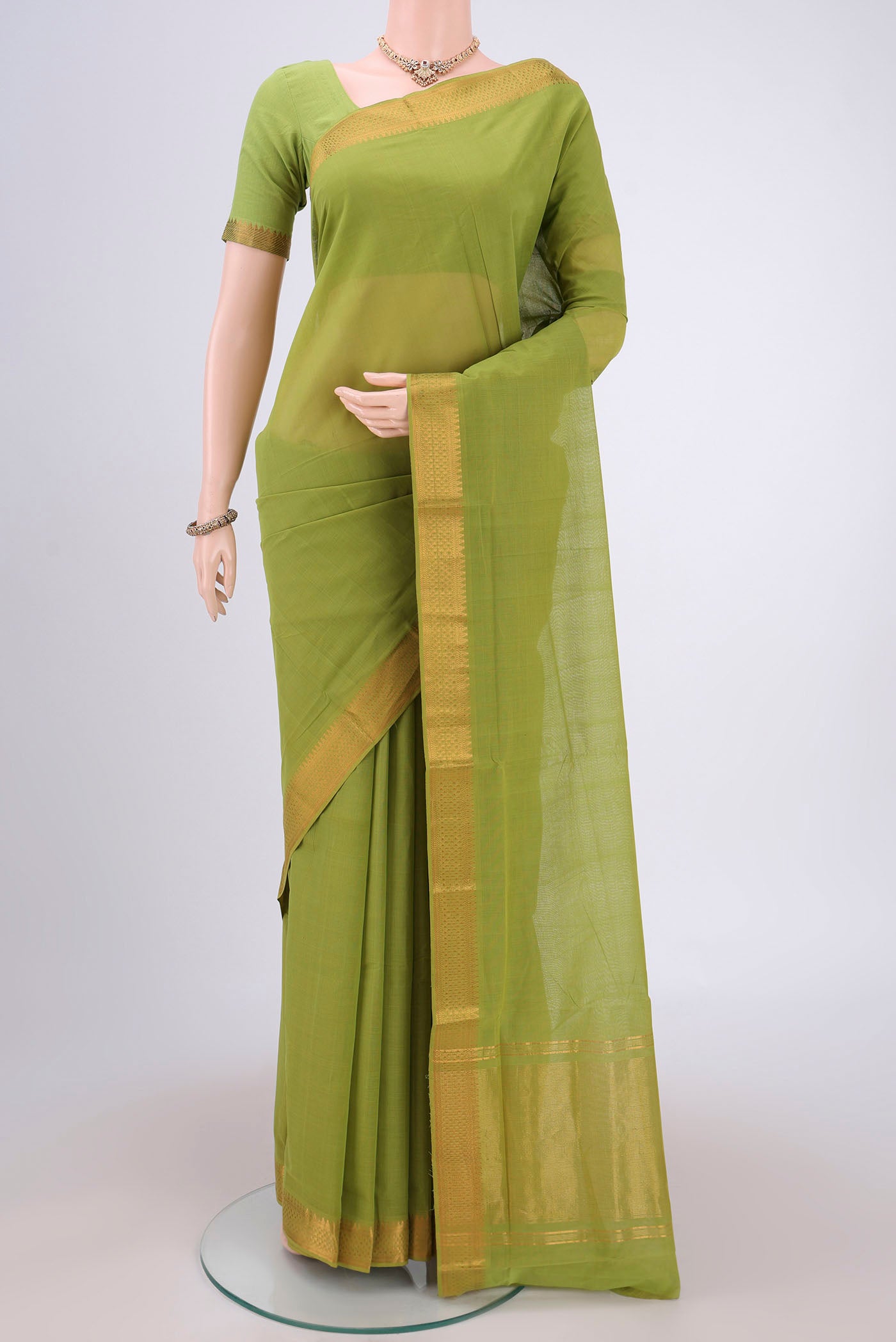 Green Mangalagiri Cotton Saree with Plain Body and Zari Border.  displayed on a mannequin