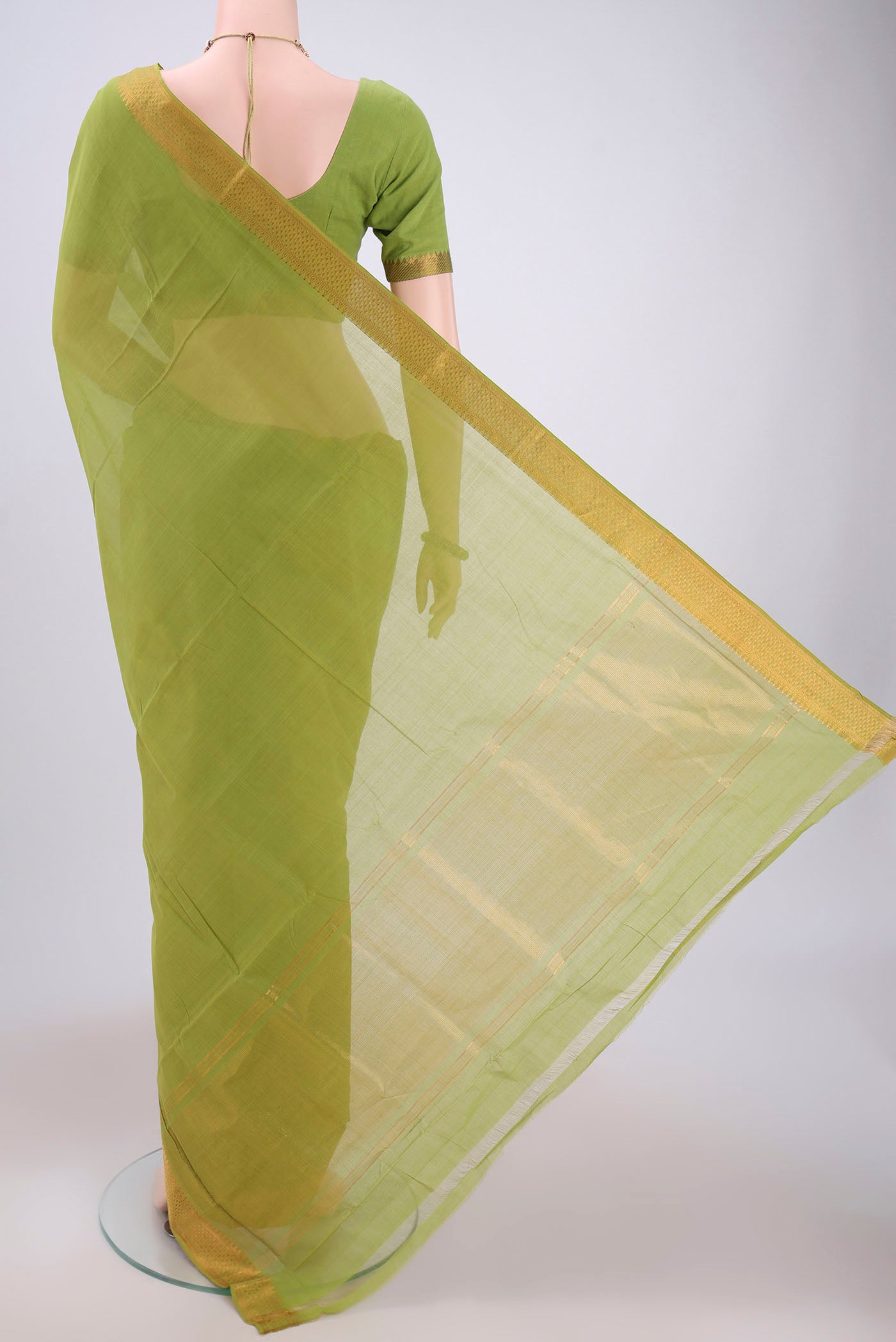 Flat view of Green Mangalagiri Cotton Saree with Plain Body and Zari Border. 