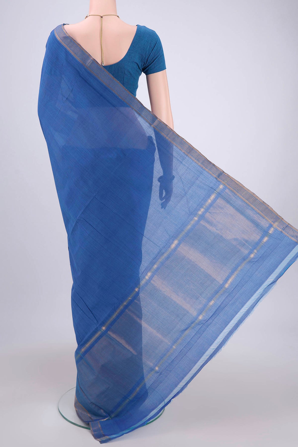 Flat view of Blue Mangalagiri Cotton Saree with Plain Body and Zari Border. 