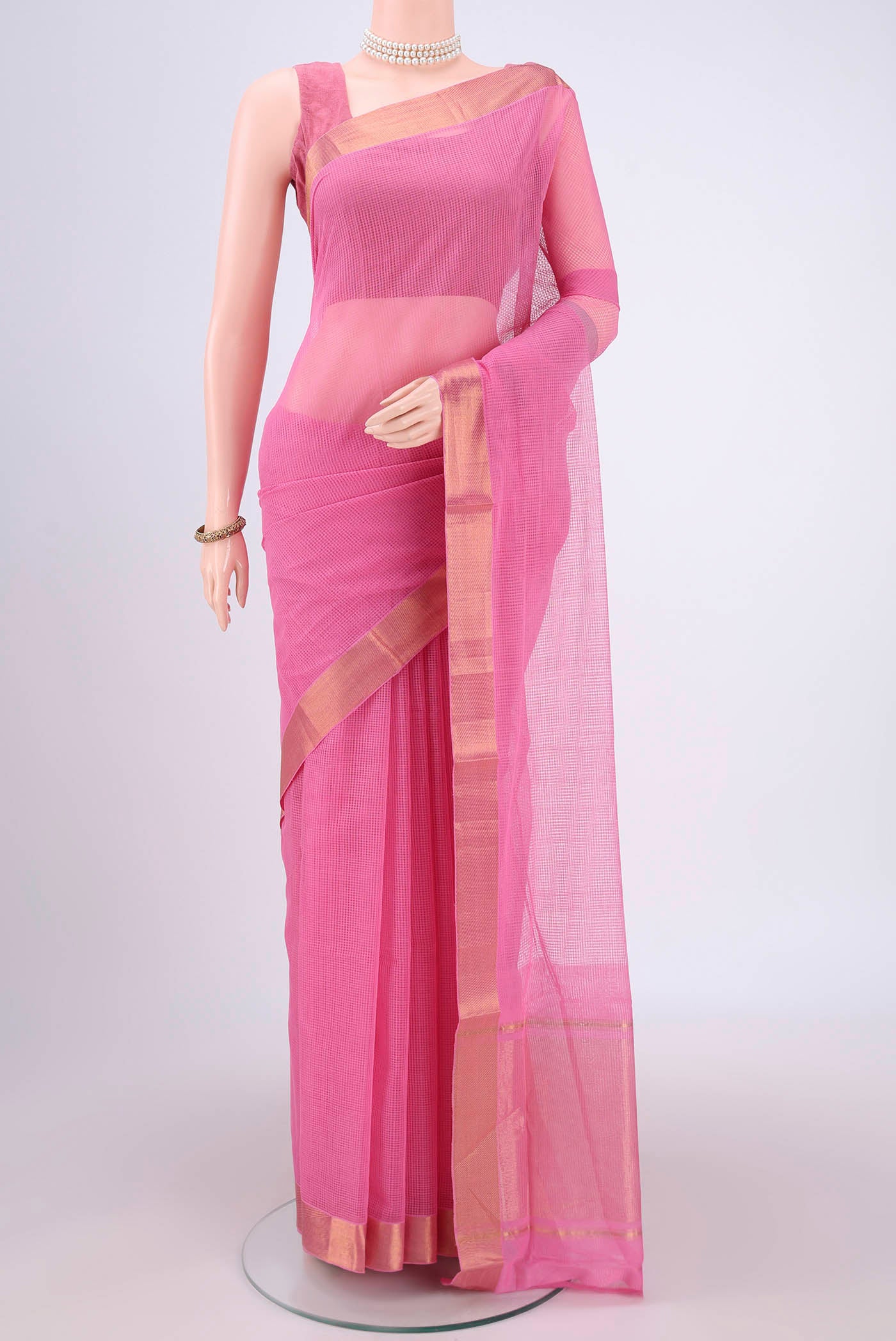 Rose pink Mangalagiri Cotton Saree with Plain Body and Zari Border.  displayed on a mannequin