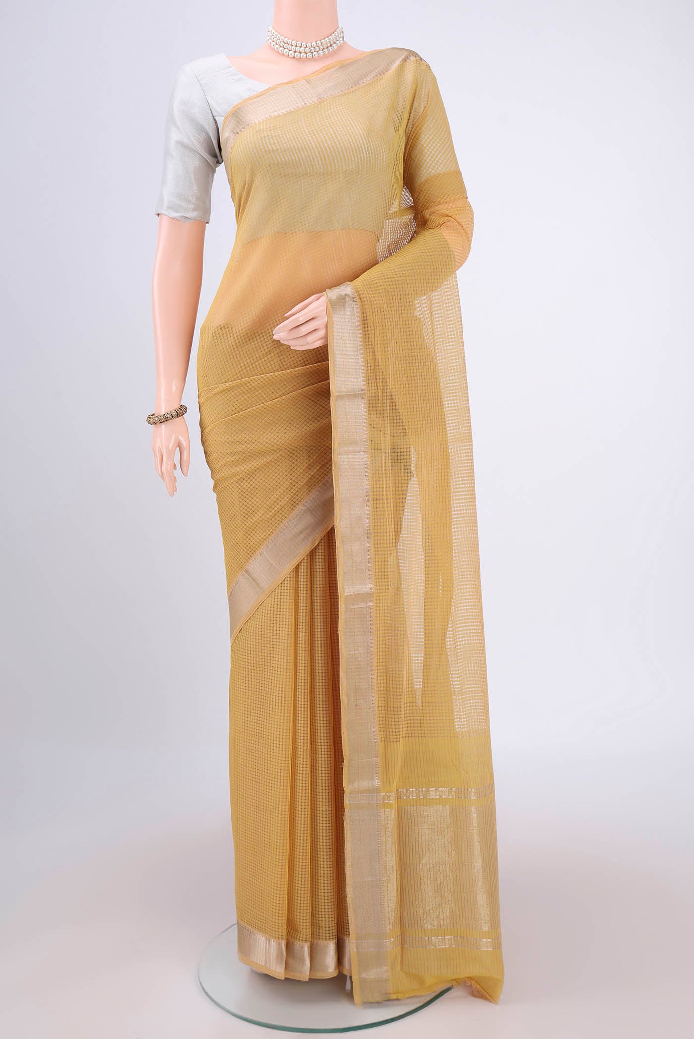 Mustard Mangalagiri Cotton Saree with Stripes on the body and Zari Border.  displayed on a mannequin