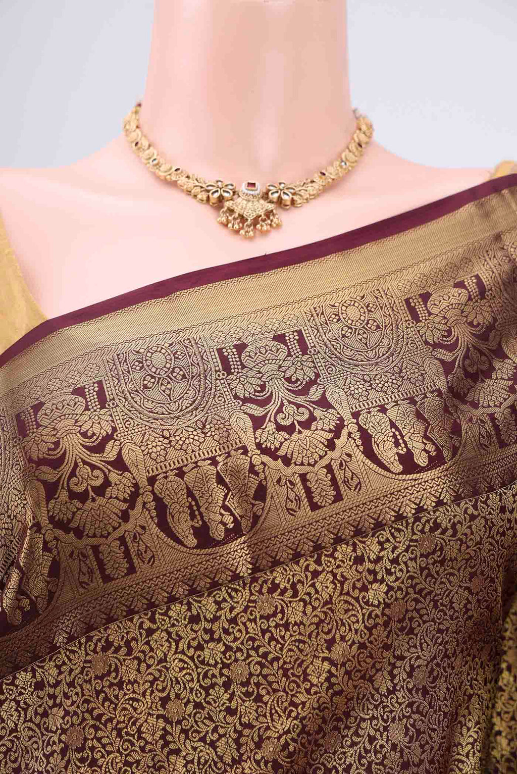 Border image of Brown Soft Silk Saree with Zari Butta on the body and Zari Border. 