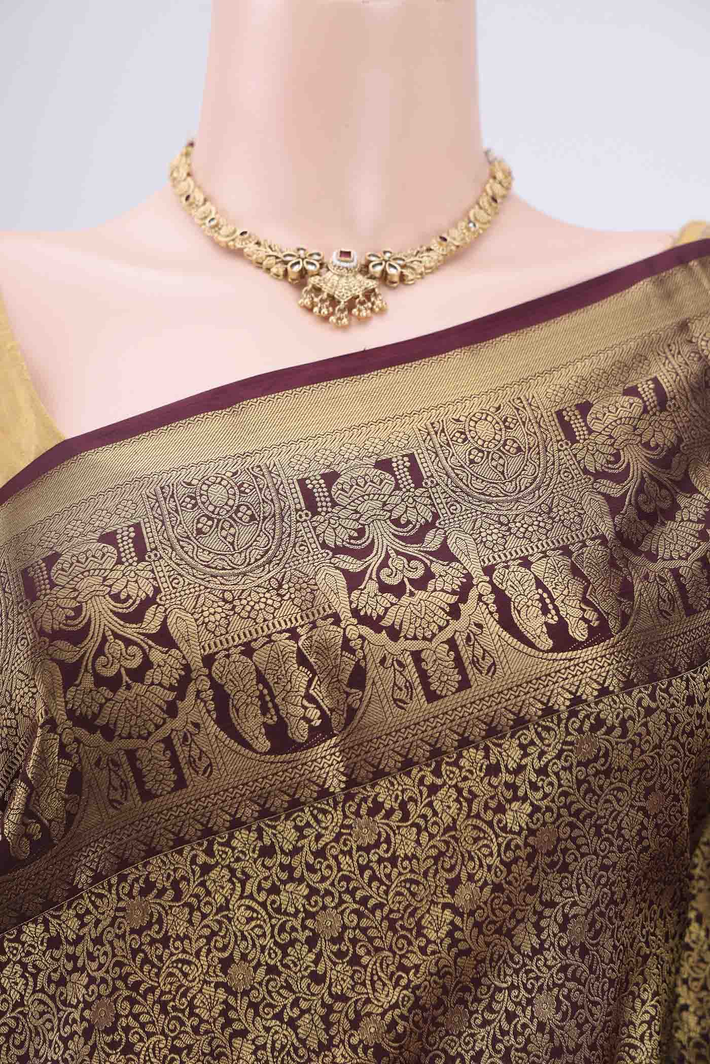 Border image of Brown Soft Silk Saree with Zari Butta on the body and Zari Border. 