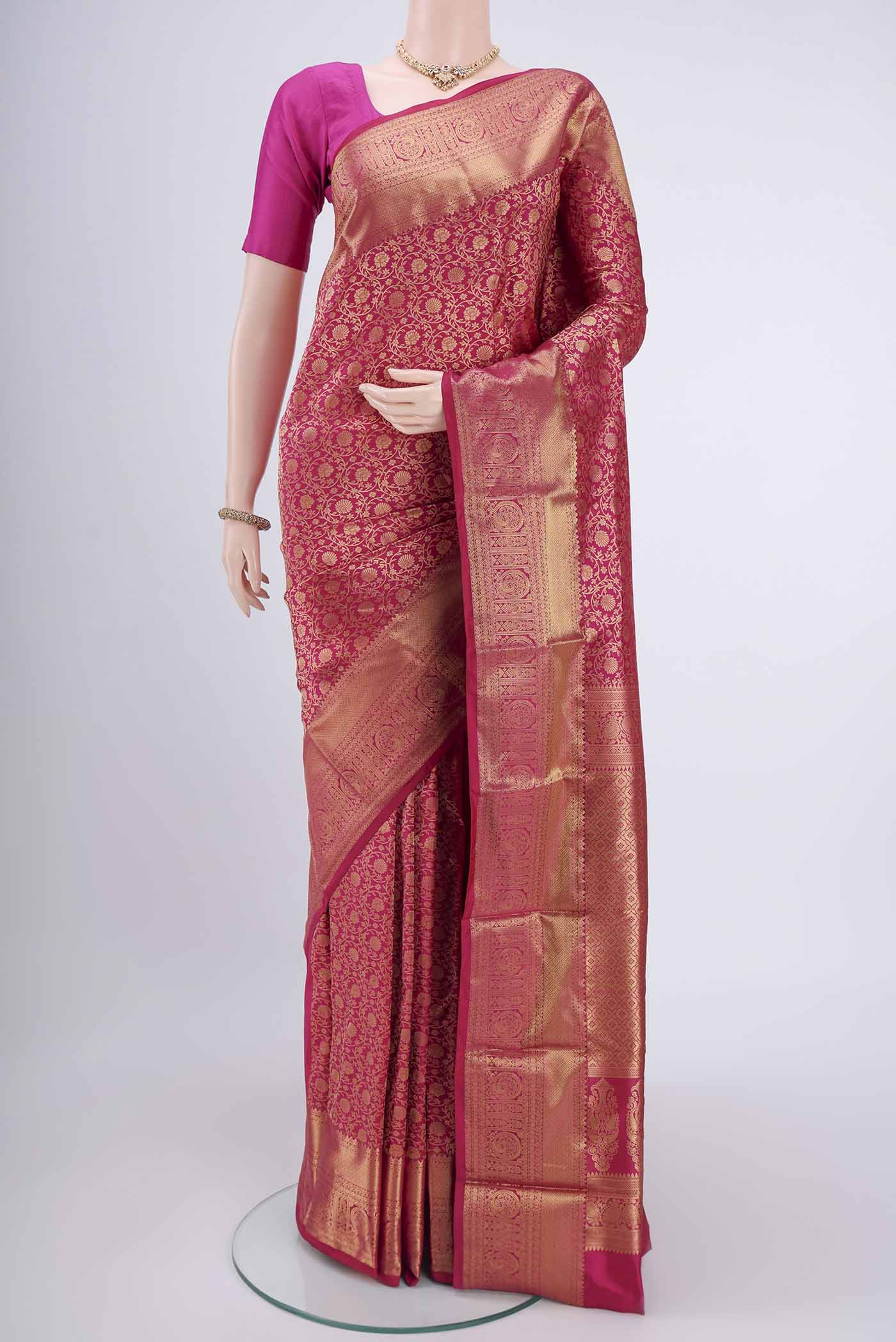 Dark Pink Bangalore Silk Saree with Zari Brocade on the body and Zari Border.  displayed on a mannequin