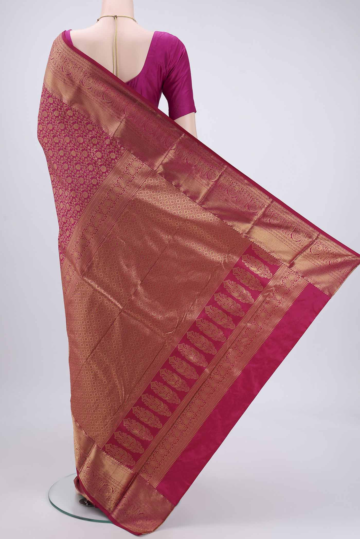 Flat view of Dark Pink Bangalore Silk Saree with Zari Brocade on the body and Zari Border. 