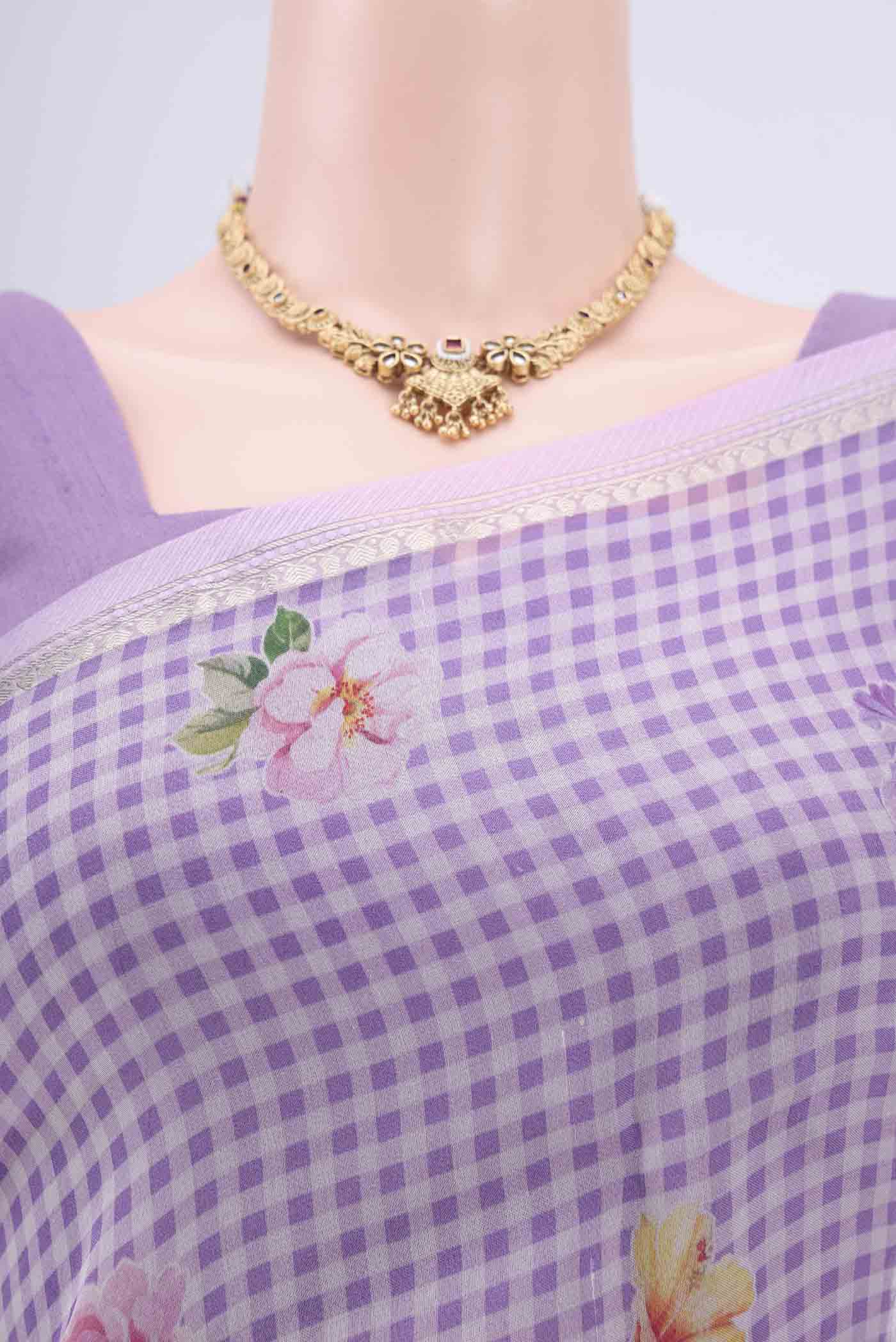 Border image of Lavender Organza Silk Saree with Printed design on the body and Zari Border. 