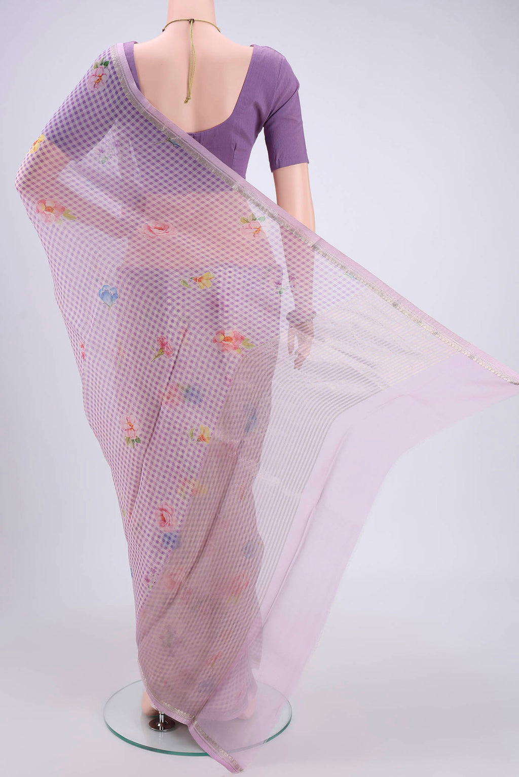 Flat view of Lavender Organza Silk Saree with Printed design on the body and Zari Border. 