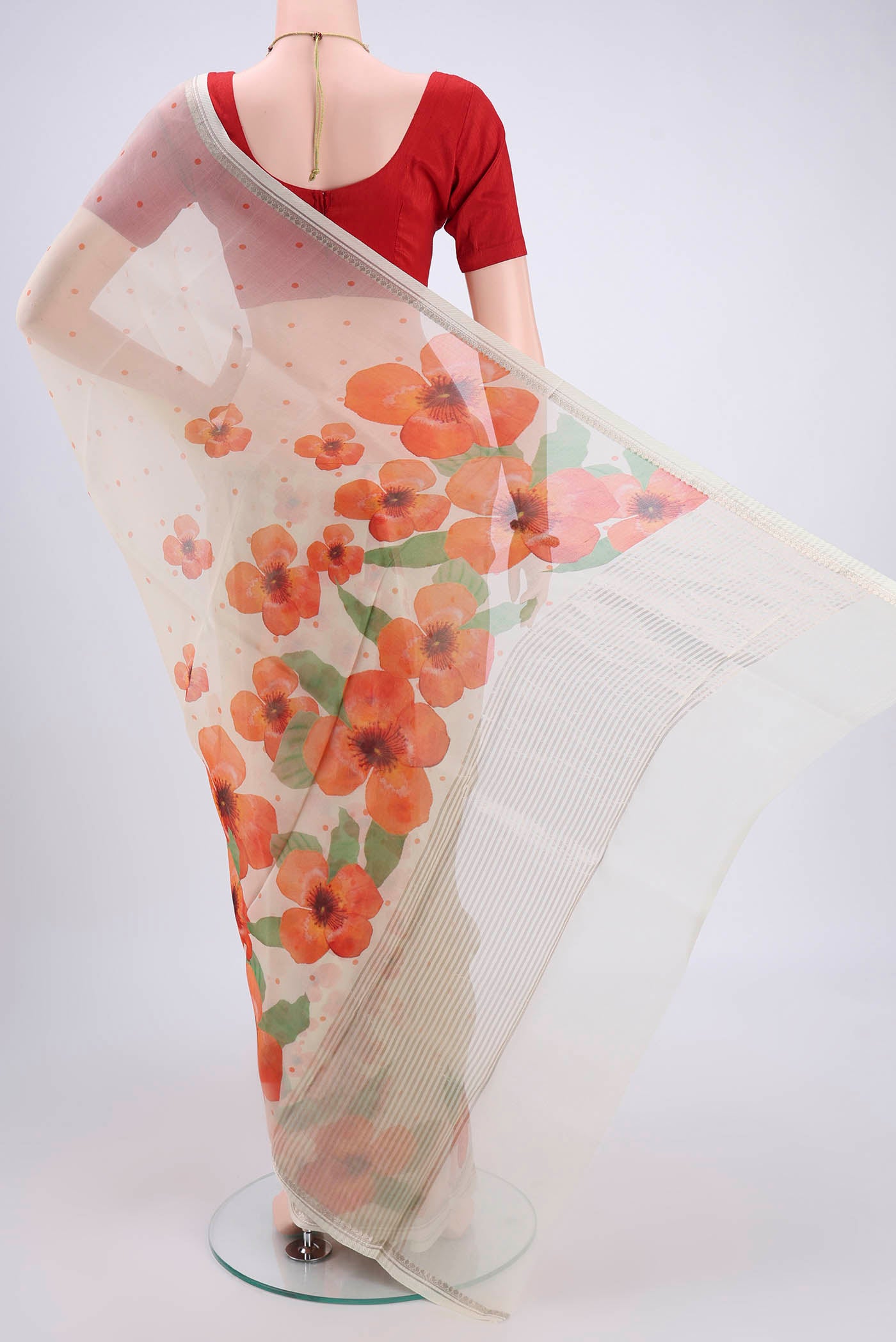 Flat view of Off White Organza Silk Saree with Printed design on the body and Zari Border. 